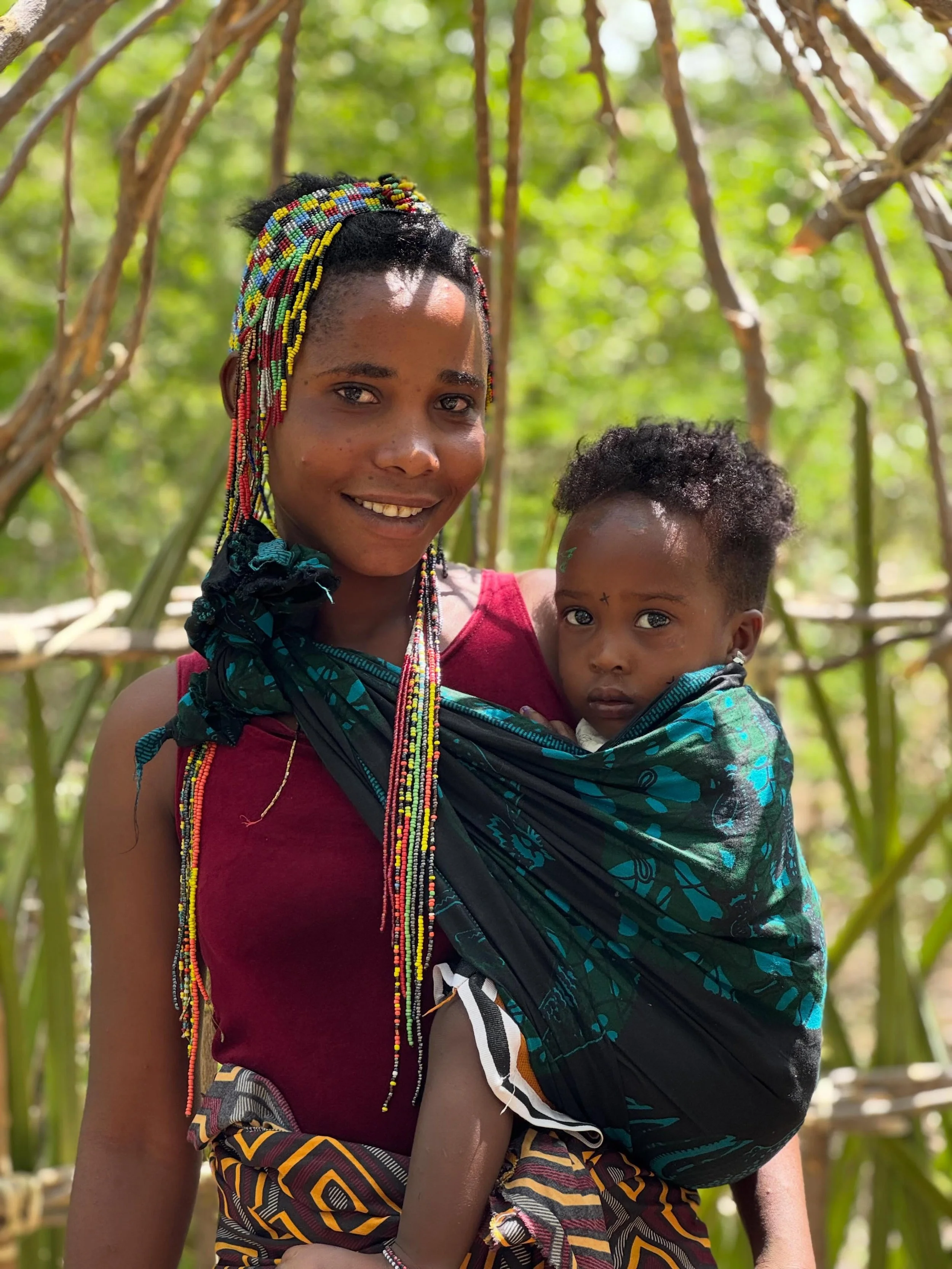Happy Friday from Gangida Camp ☀️ 
Spent some time with this healthy mother and baby while visiting. Supporting mothers and infants continues to be a huge part of Meleka&rsquo;s work with the Hadza community. From healthcare resources, check-ins, bir