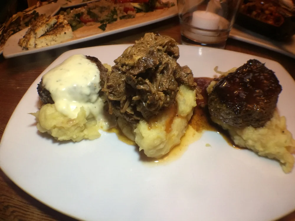  Trois Mignons  debris, house made worcestershire, Stilton, caramelized onion mashed potatoes 