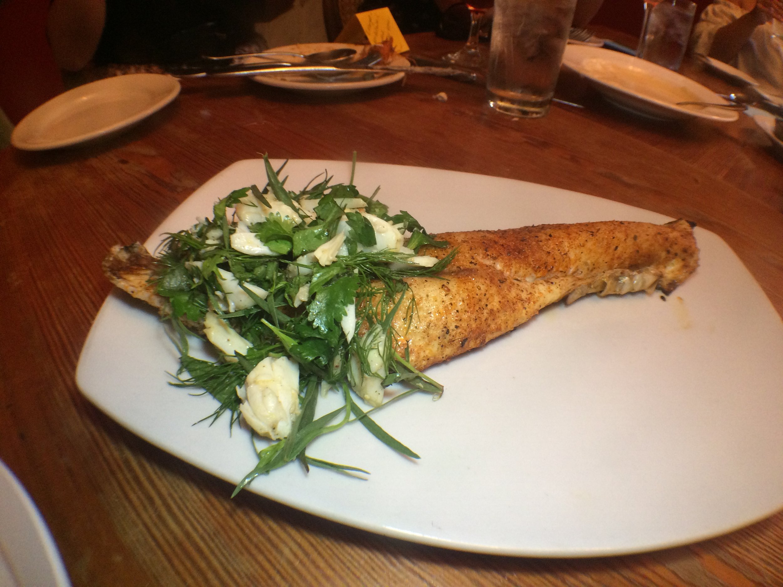  Redfish on the Half Shell  grilled Redfish on the half shell, crabmeat, soft herb salad 