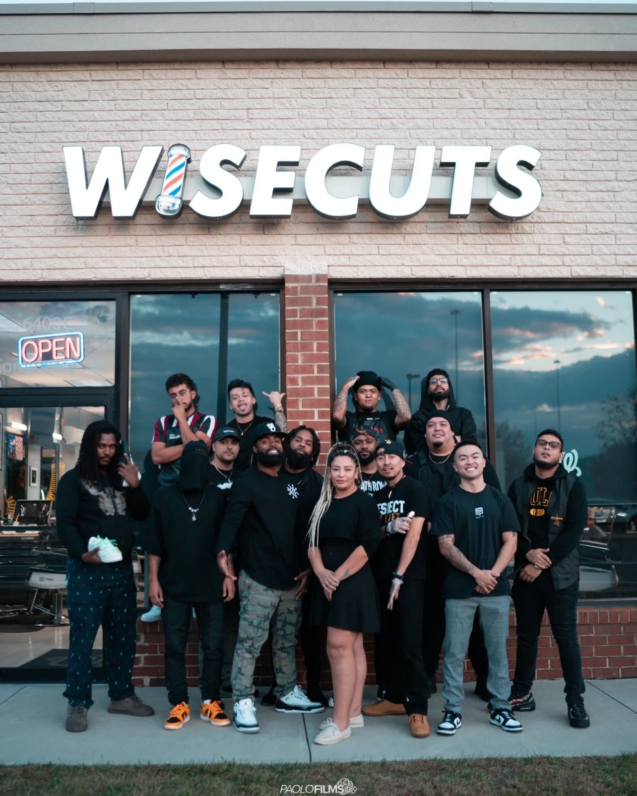 Wisecuts Springfield Shop team in front of the front entrance and sign