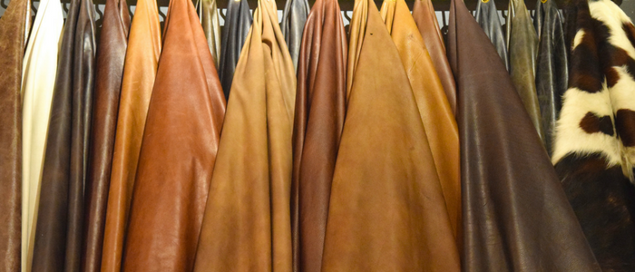 brown and tan leather hides hanging, things to know before buying leather hides