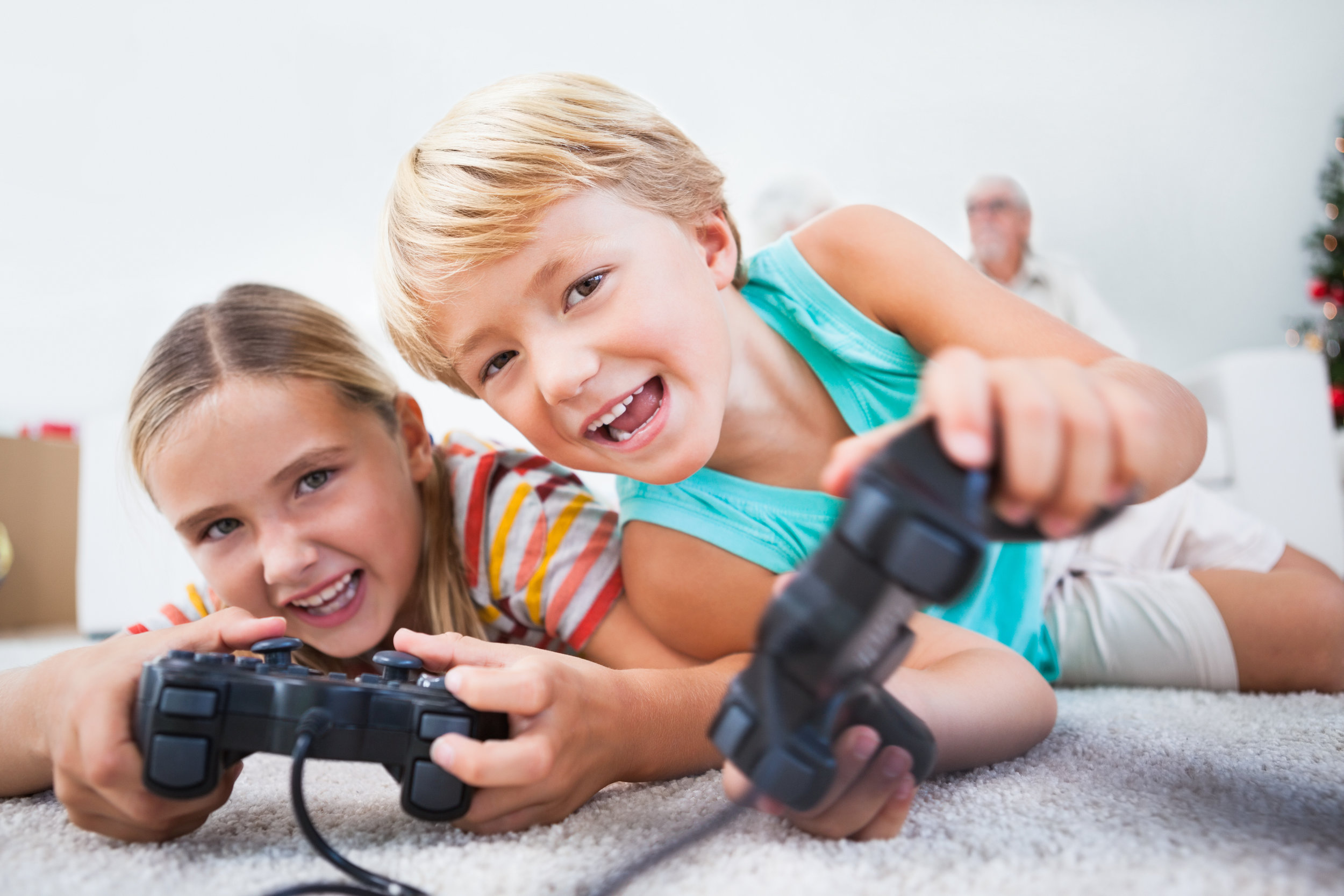 Two children are learning through video games.
