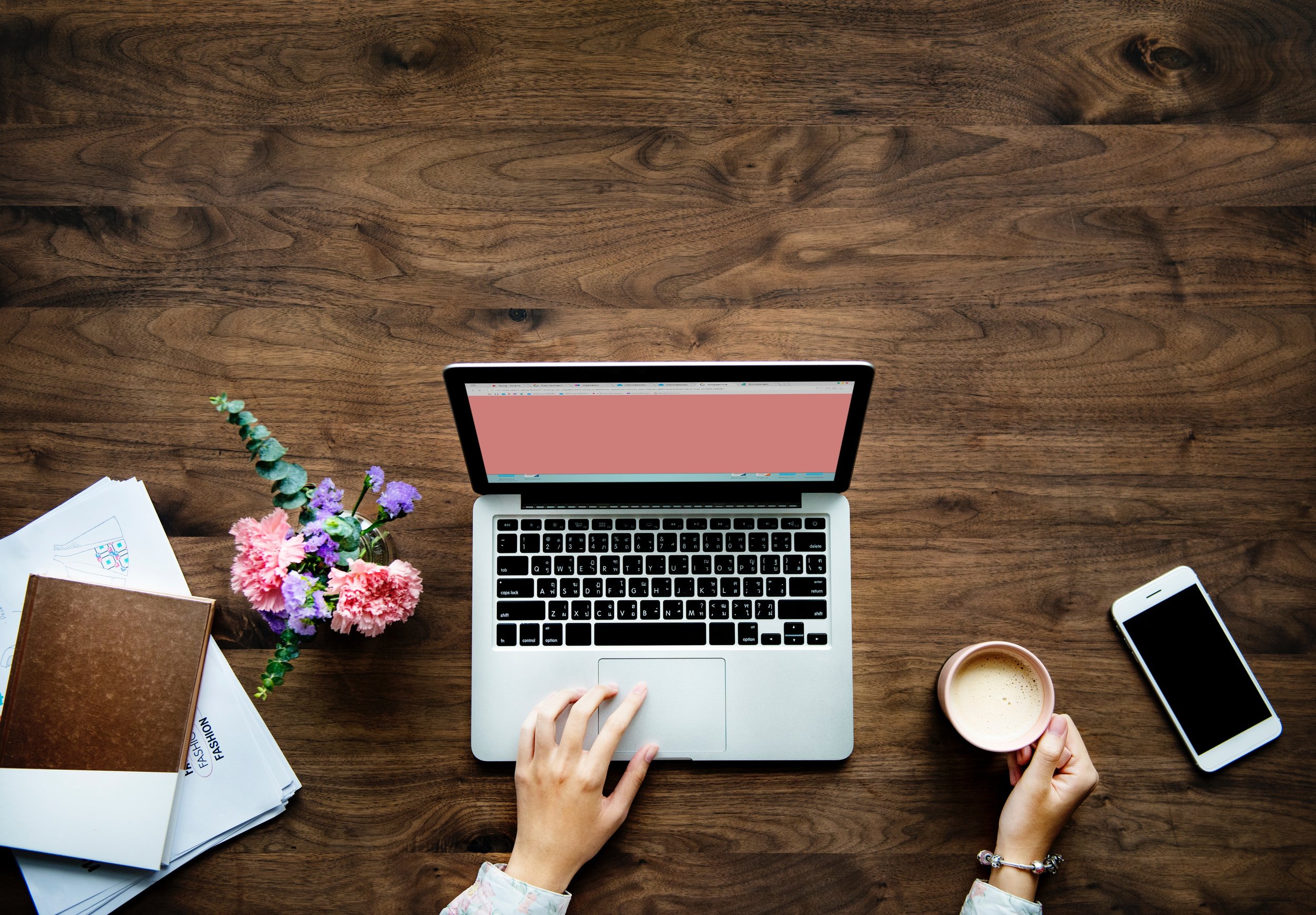 Woman curates online learning materials on a laptop computer.