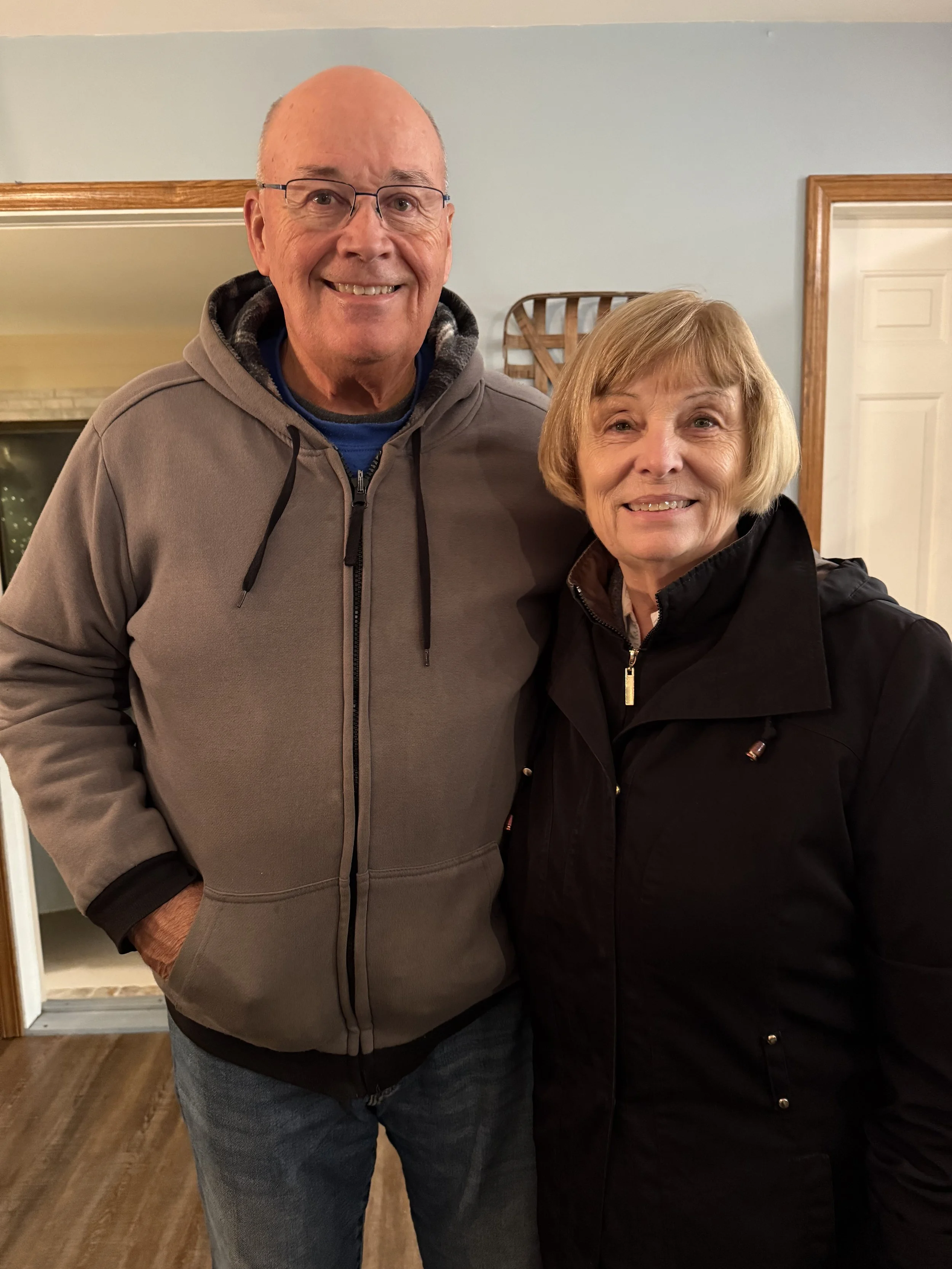 older couple smiling at the camera