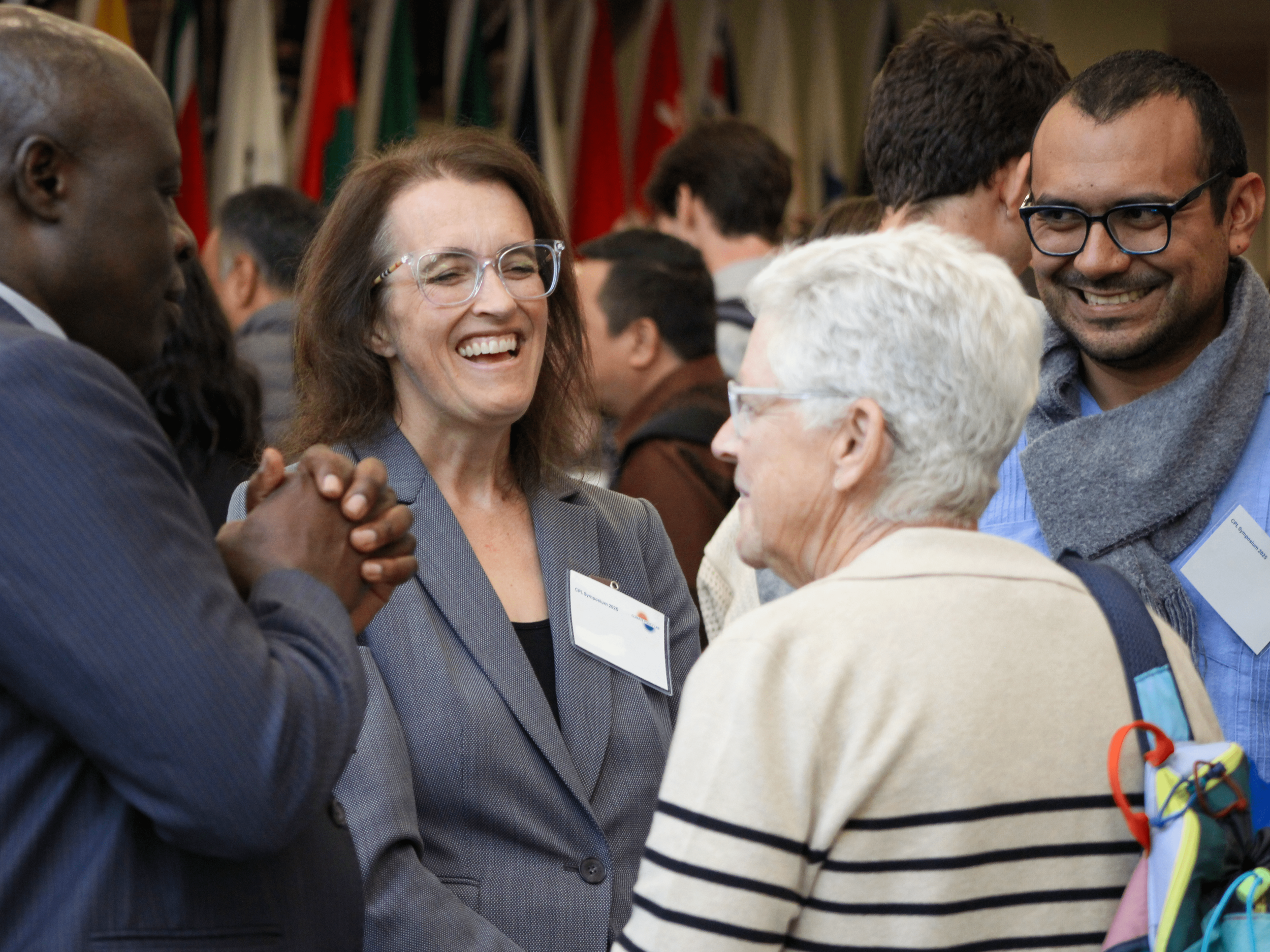 a group of people speaking informally in a conference setting