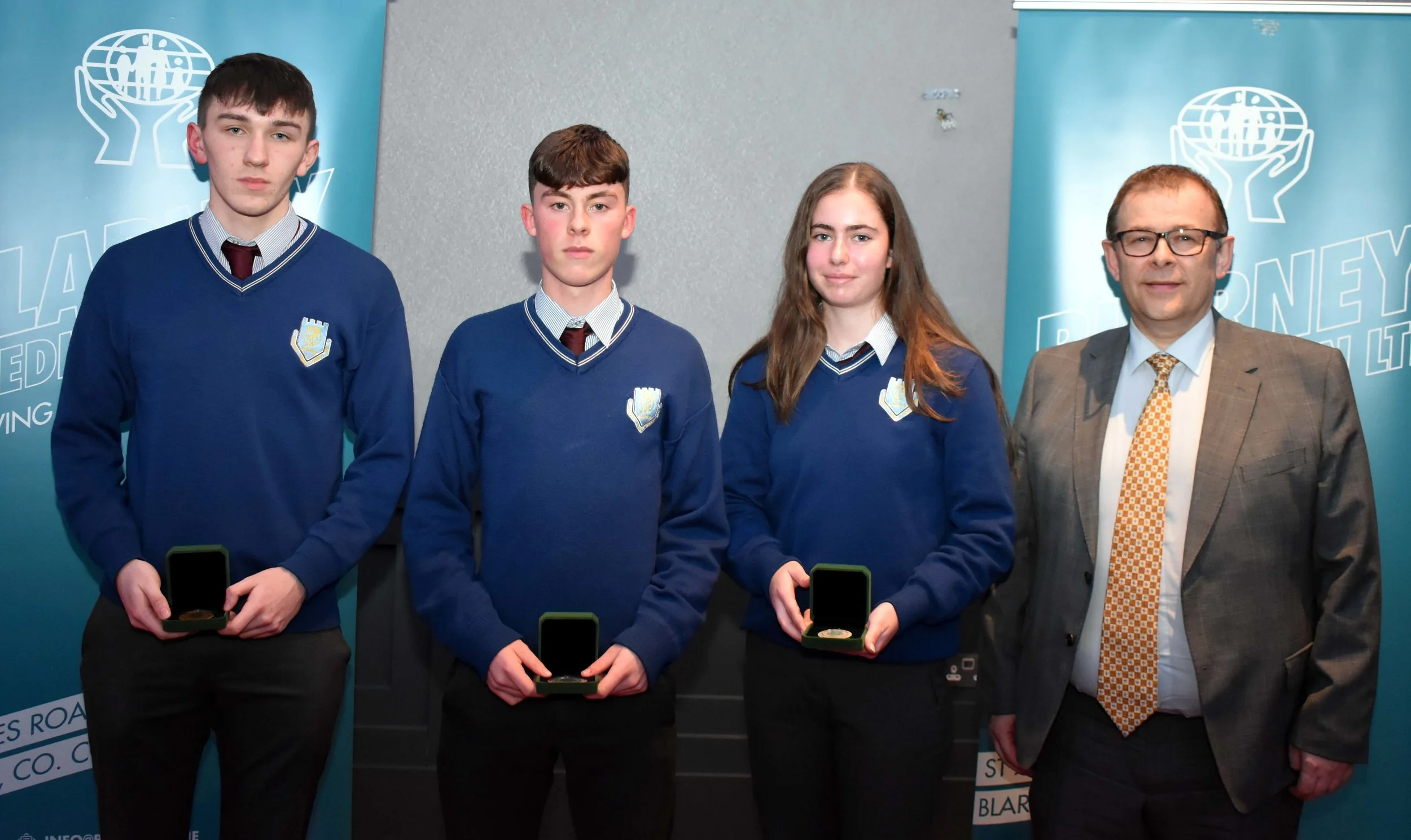Junior Certificate Medal Winners: Mark Maguire, Niall Cremin and Aideen Donovan. (Pictured with Mark McGloughlin - BOM and Blarney Credit Union)