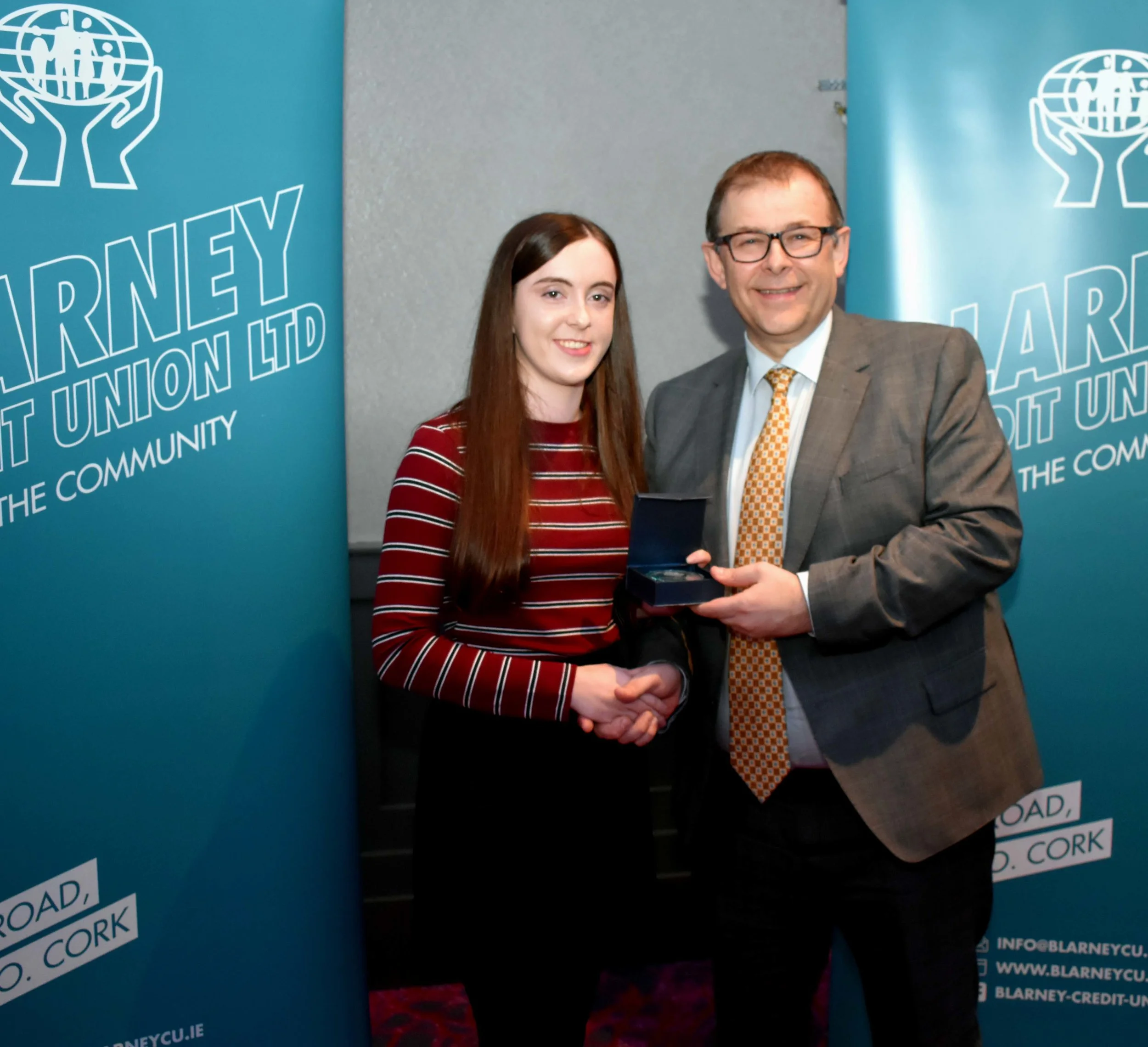 Laoise Gavin receiving the Gold Leaving Certificate Medal for achieving 625 points. (Pictured with Mr. Mark McGloughlin - BOM and Blarney Credit Union)
