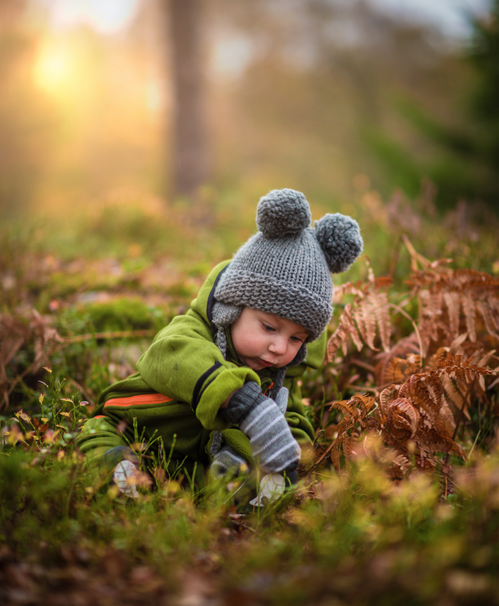Banner 5- Boy playing in grass.png