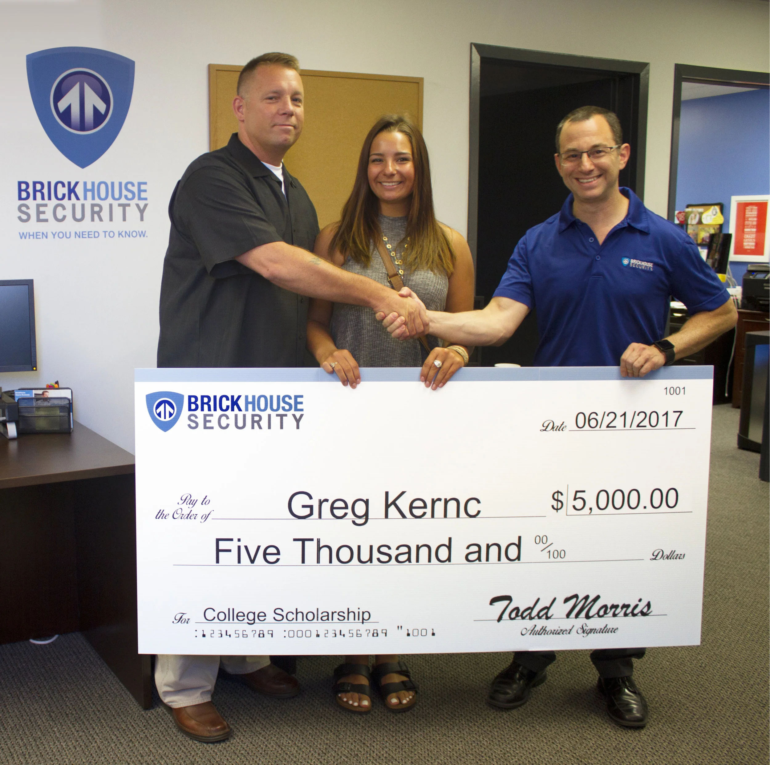 Officer Greg Kernc alongside his daughter Courtney, recipients of the 2017 BrickHouse Scholarship