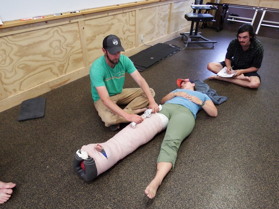 Dave uses elk bones for a demo while teaching about femur fractures in Wyoming.