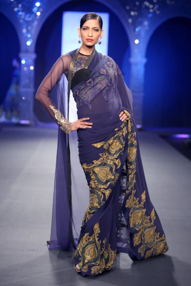 Royal purple and gold embellish this wedding sari