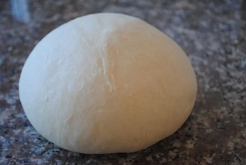 The dough after three folds. Note how much smoother it looks compared to the just mixed photo.