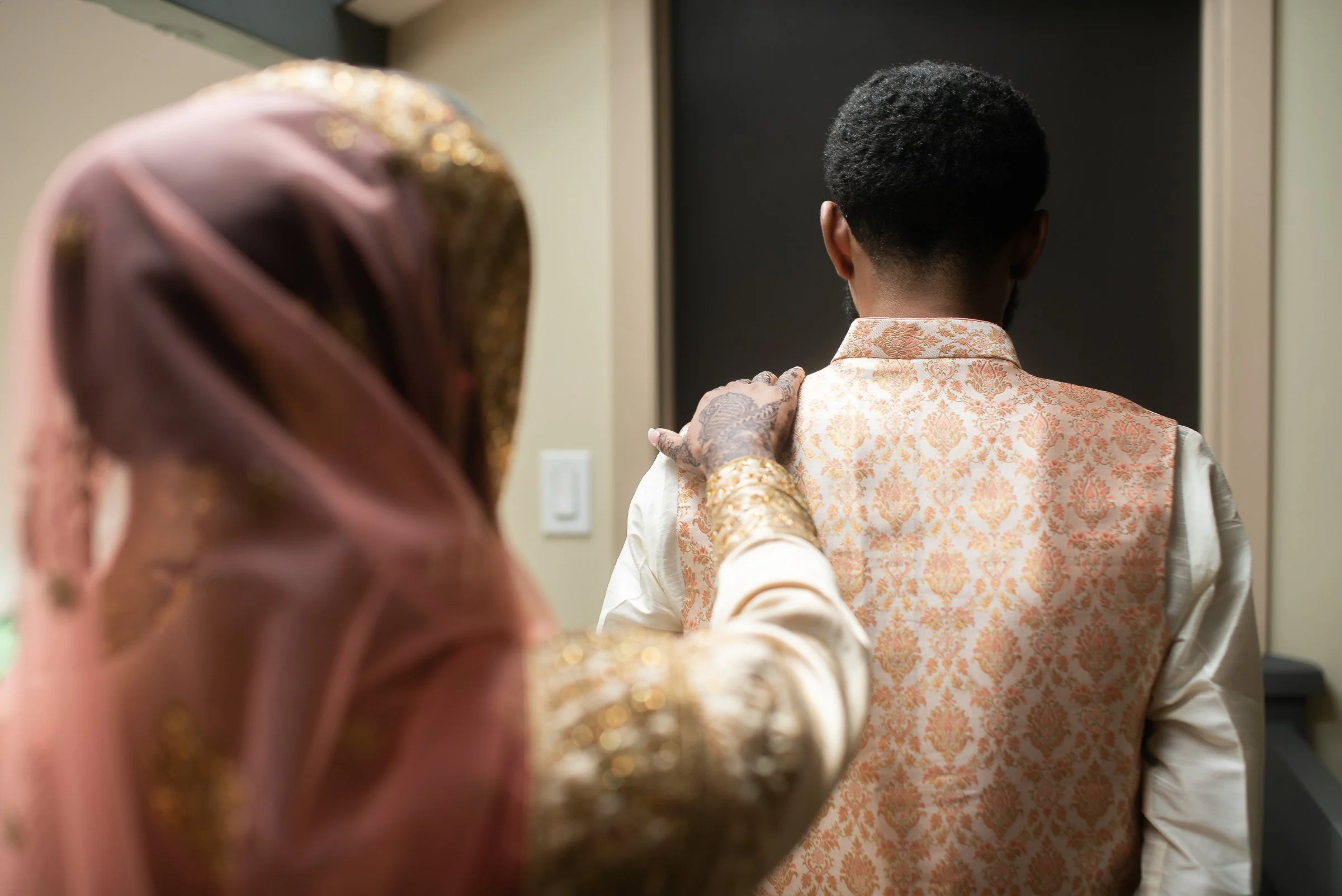 A hand on the shoulder just before the first look