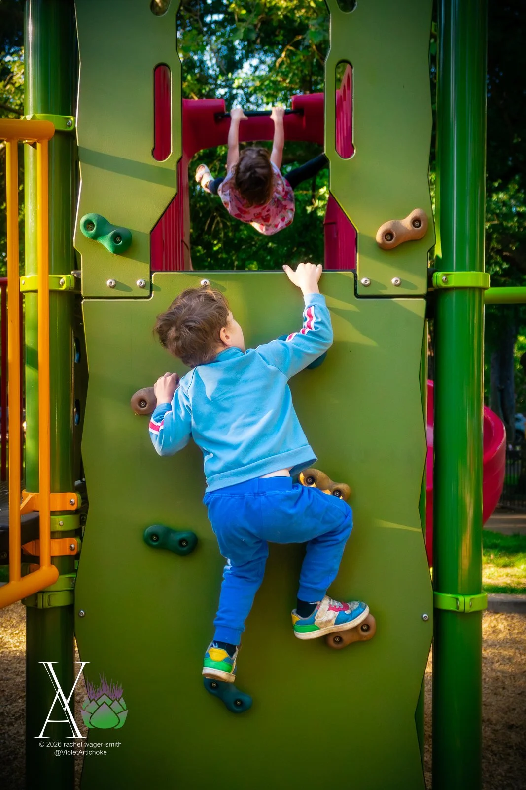 Young Kids Playing on a Rock Wall