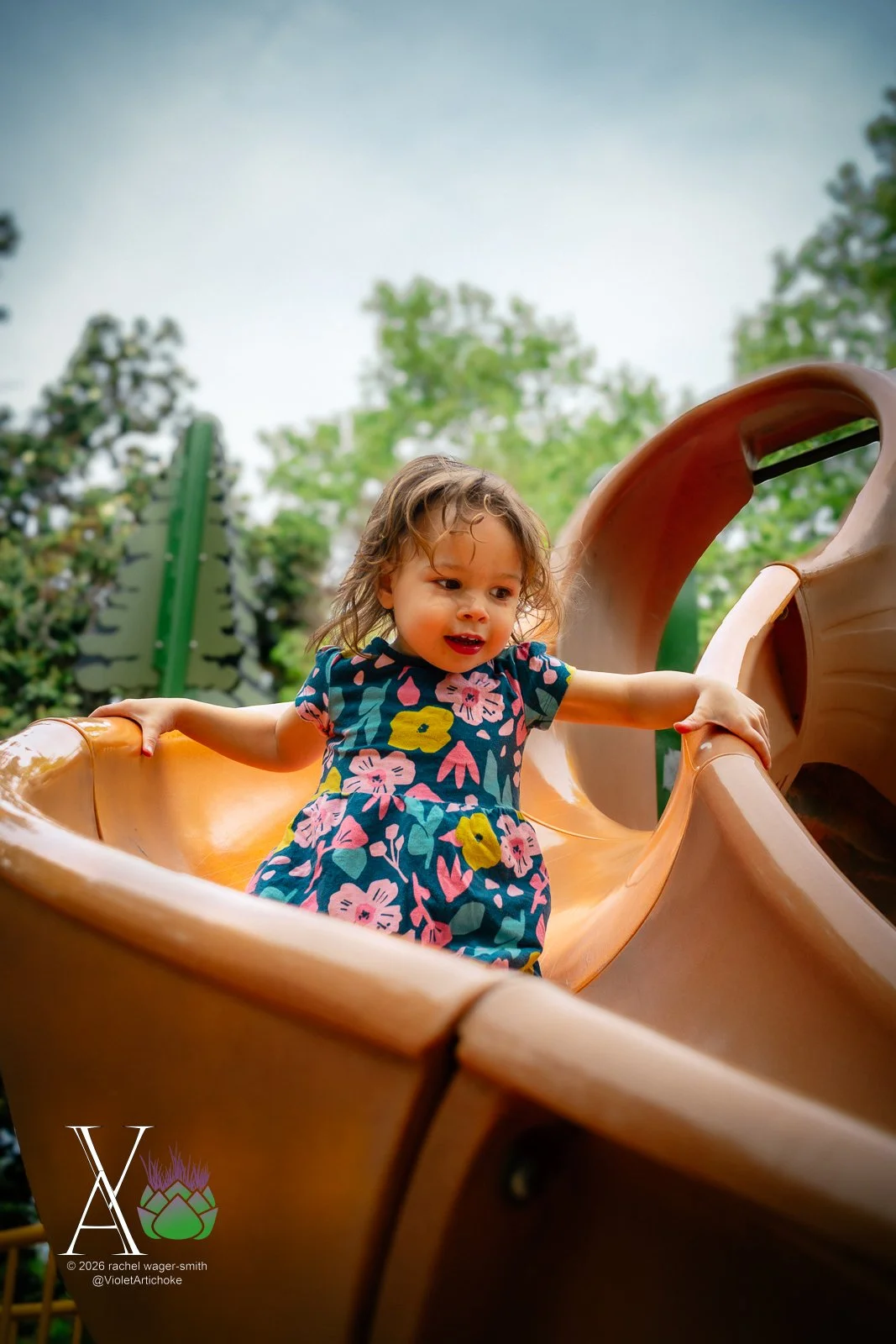 Young Girl on Orange Slide
