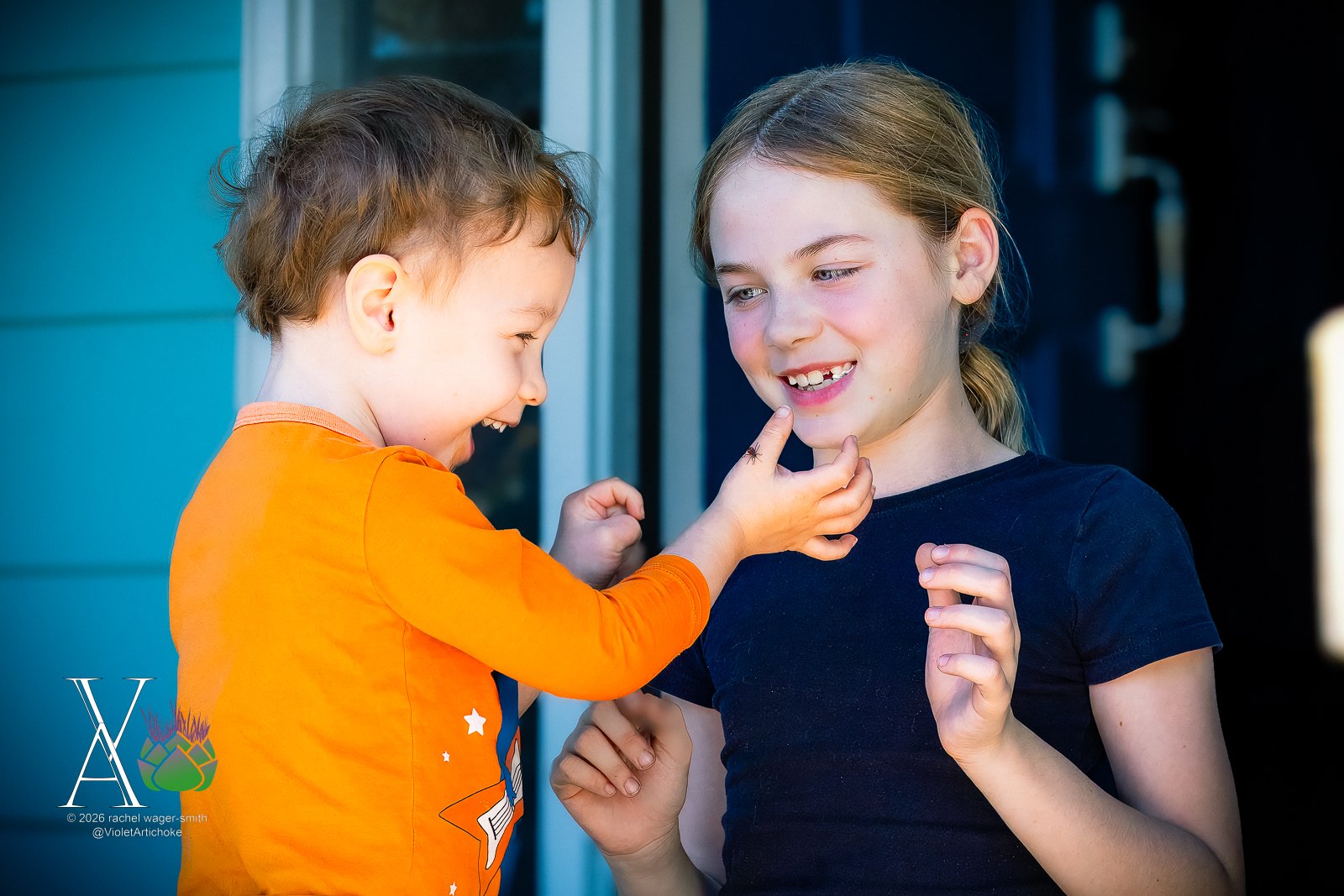Young Boy and Girl Excitedly Look at Bug