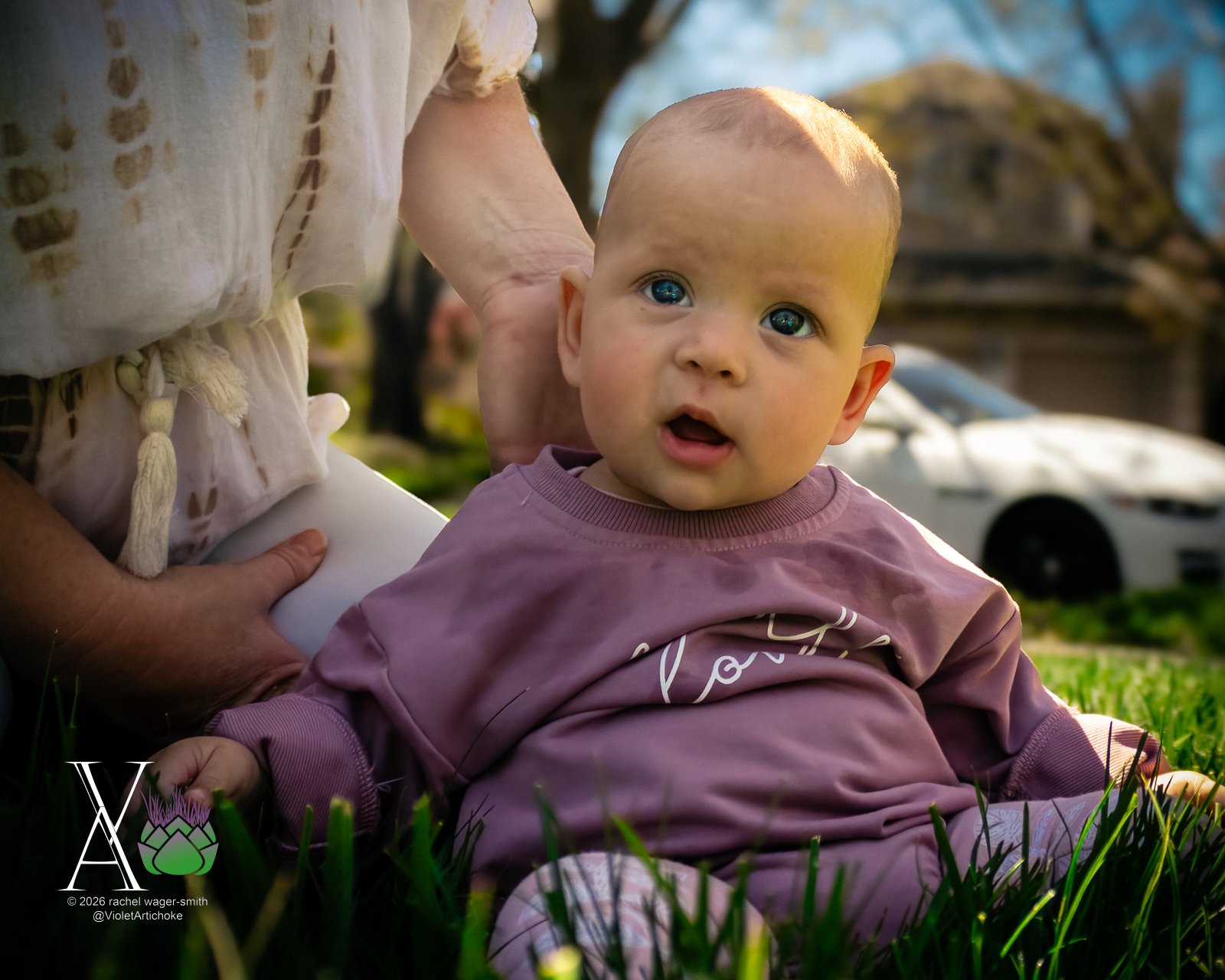 Baby Sits on Grass