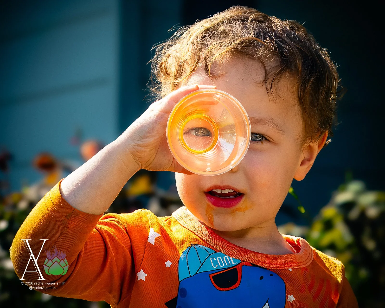 Young Boy Looks Through Magnifying Glass