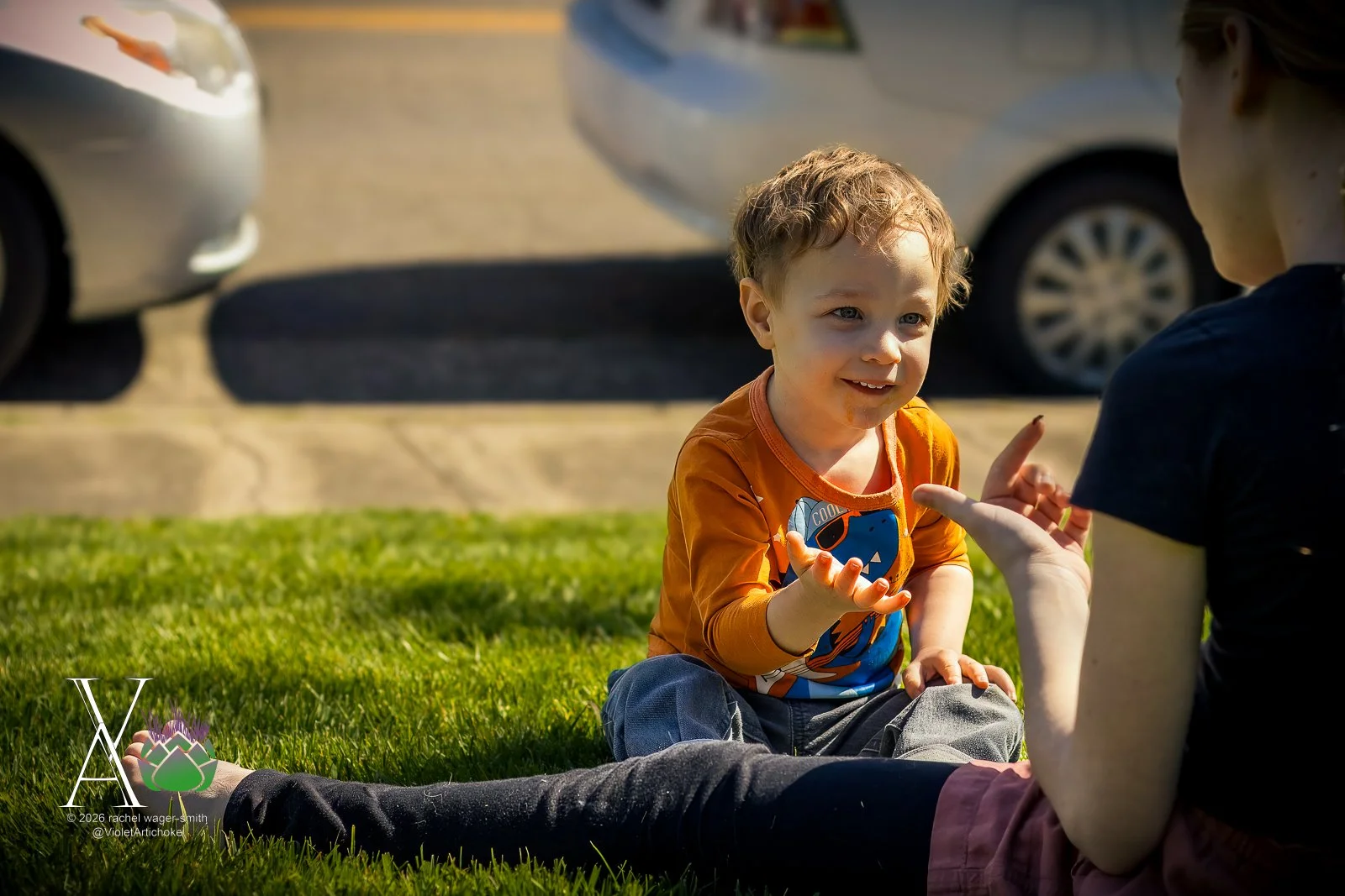 Young Boy Watches Bug on Girl