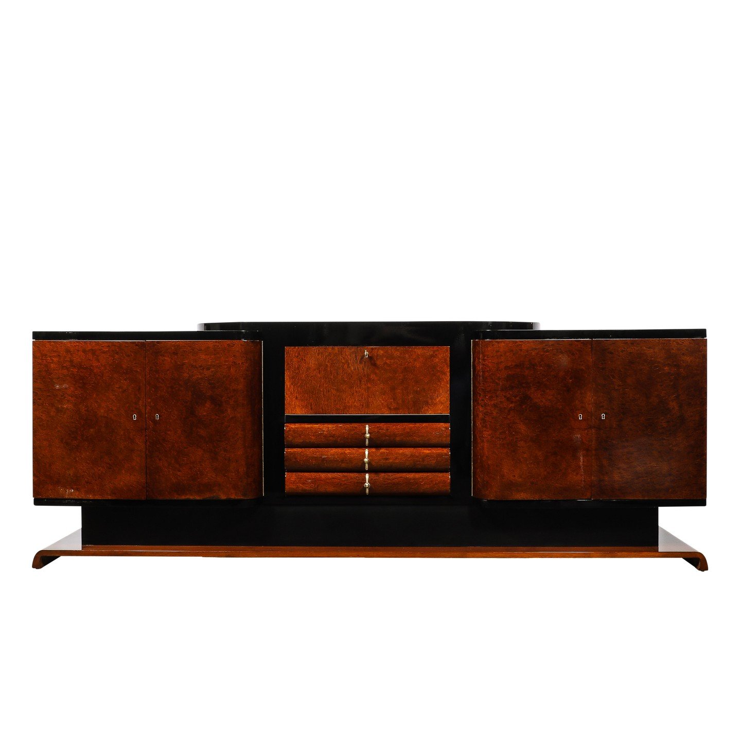 Art Deco Sideboard in Bookmatched &amp; Burled Amboyna Wood, Mahogany &amp; Walnut Base

This remarkably beautiful Art Deco Sideboard in Bookmatched &amp; Burled Amboyna Wood, Mahogany, &amp; Walnut Base with Black Lacquer Detailing &amp; Brass Fitti