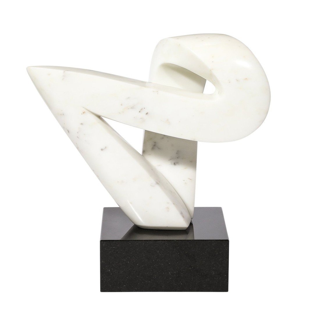 Mid-Century Modern Carrara Marble Abstract Sculpture

This elegantly bold Mid-Century Modern Carrara Marble Abstract Sculpture originates from the United States, Circa 1970. Features an abstracted geometric form with a remarkable sense of movement an