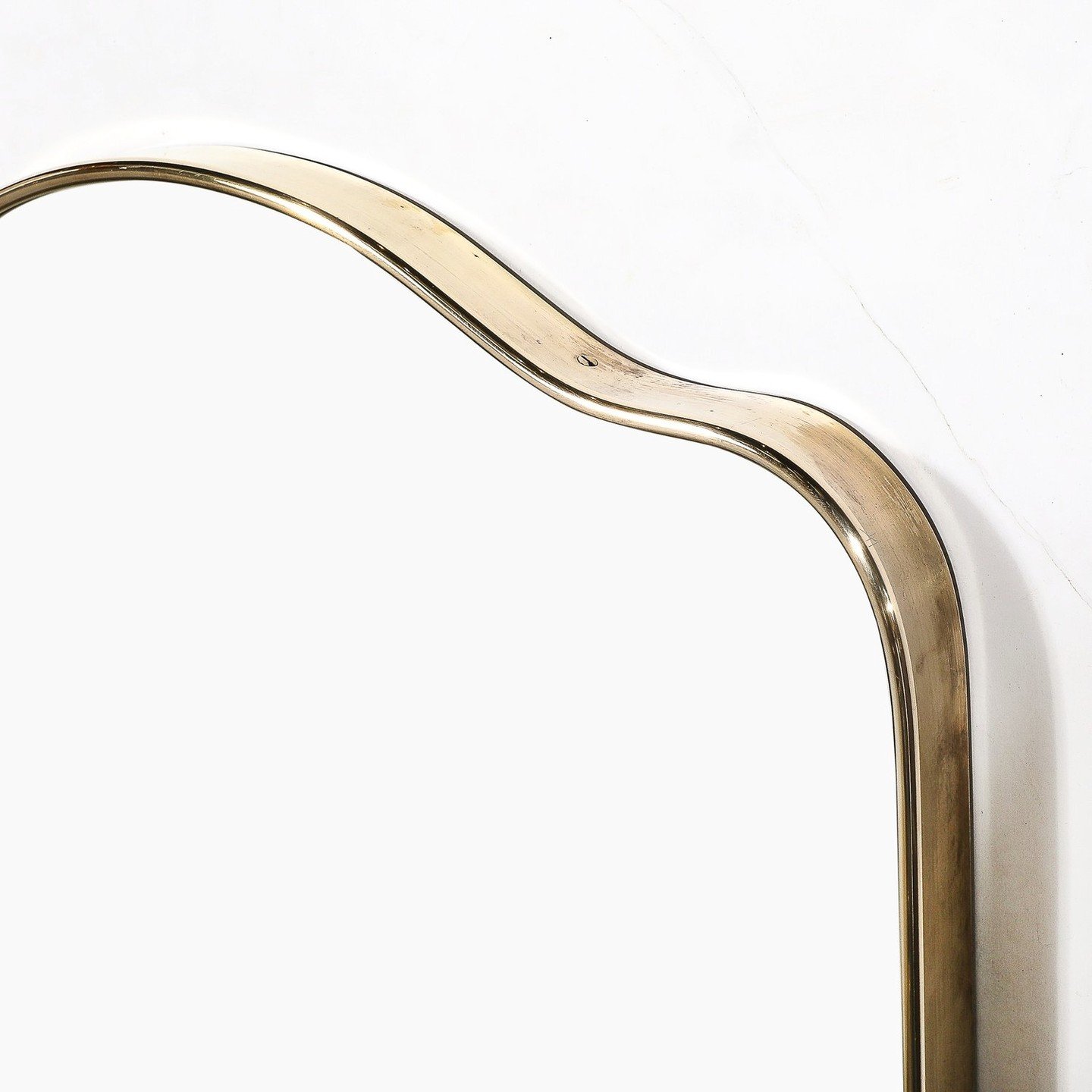 Mid-Century Modernist Vertical Brass Wrapped Mirror With Rounded Arch Detailing

This minimal and beautifully made Mid-Century Modernist Vertical Brass Wrapped Mirror With Rounded Arch Detailing originates from Italy, Circa 1960. Features a stunning 