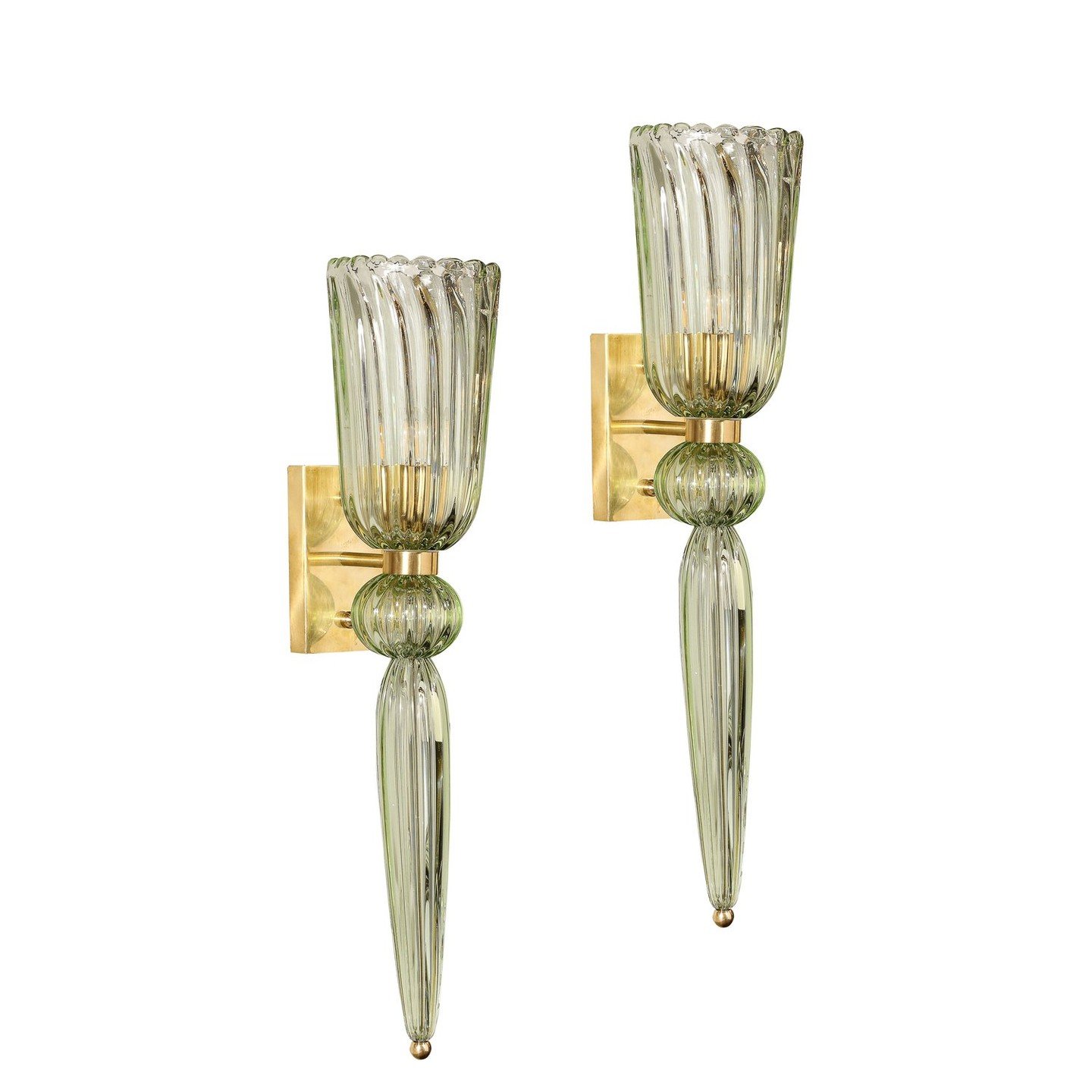 Modernist Celadon Hand-Blown Murano Glass &amp; Brass Sconces with Elongated Drop

This elegantly reserved pair of sconces originates from Italy during the 21st century. Composed in a stunning celadon hue of semi-translucent handblown Murano glass, d