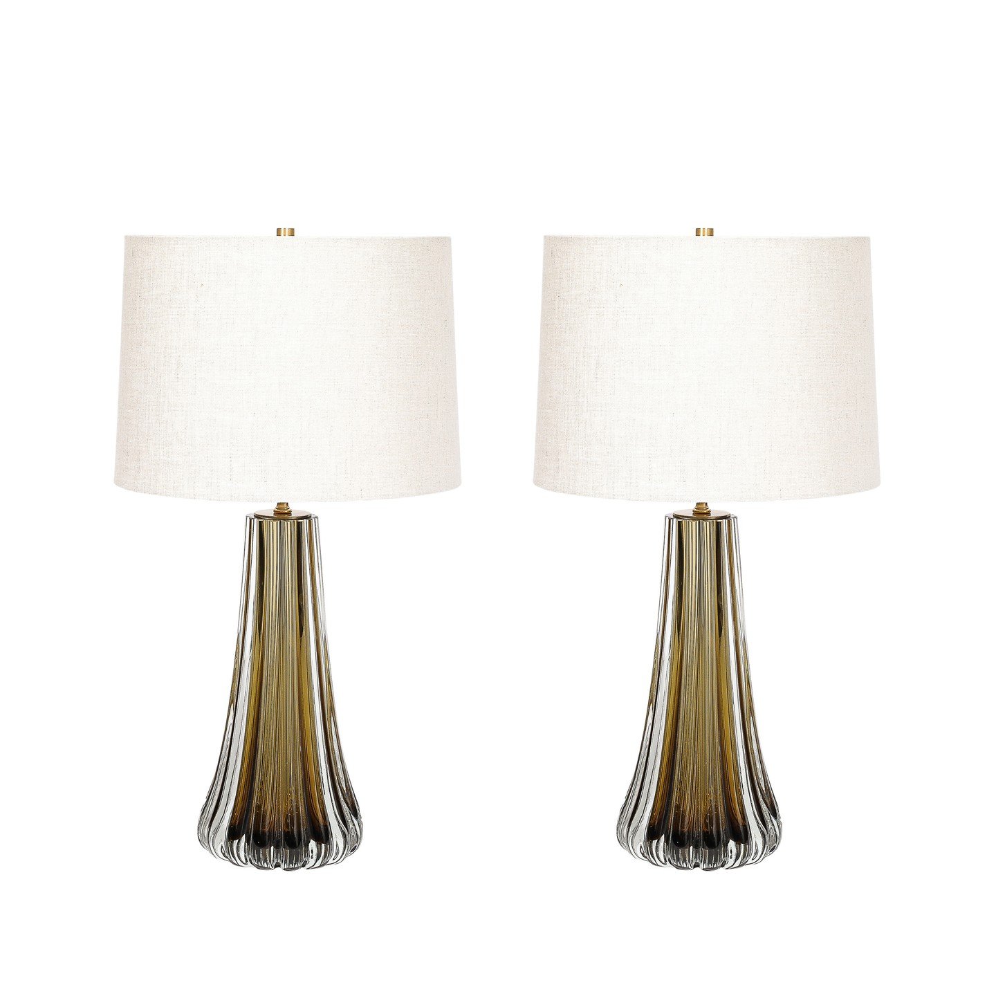 Modernist Hand-Blown Fluted Smoked Topaz Murano Glass &amp; Brass Table Lamps

This exquisitely elegant Pair of Modernist Hand-Blown Murano Glass Table Lamps in Smoked Topaz W/ Stylized Fluted Detailing originate from Italy during the 21st Century. T