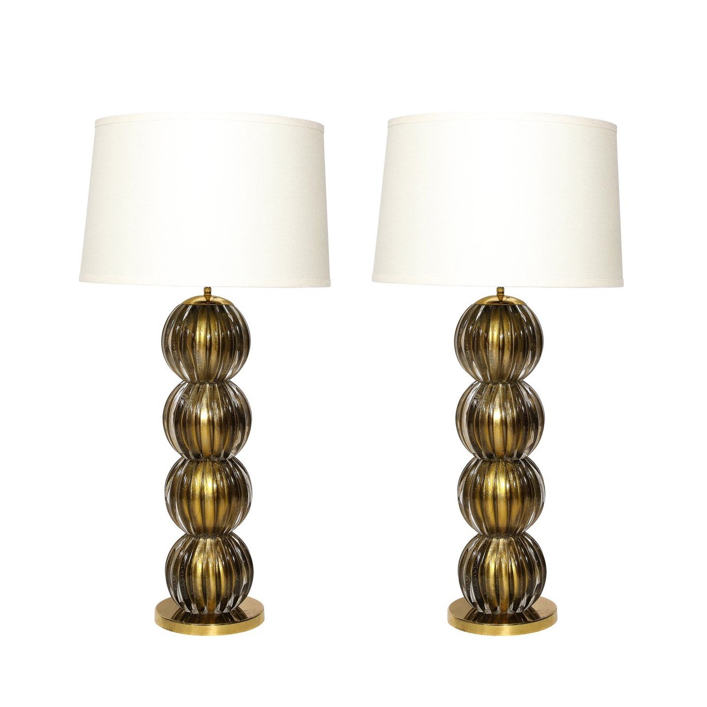 Large Scale Modernist Hand-Blown Murano Glass Table Lamps in Smoked Gold

This impressive pair of large scale table lamps were realized in Murano, Italy- the island off the coast of Venice renowned for centuries for its superlative glass production- 