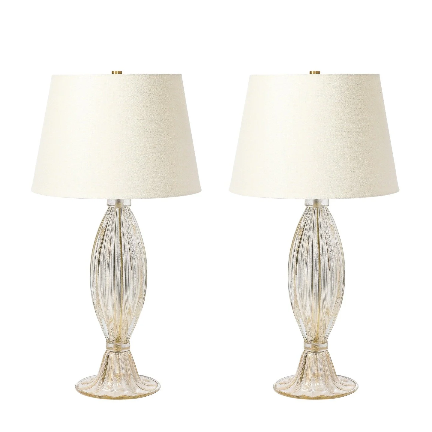Modernist Hand-Blown Murano Glass Fluted Table Lamps W/ 24K Gold Fleck Detailing

Italy, 21st Century

Dimensions:

Height: 30 in (76.2 cm) x Diameter: 16 in (40.64 cm)

Diameter of Base: 8&quot;
.
.
.
.
.
#antiquefurniture
#vintagefurniture
#antique