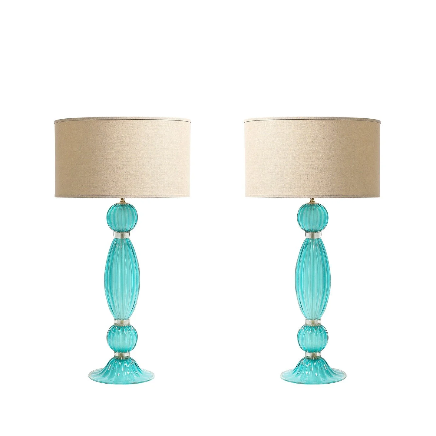 Pair of Hand-Blown Aquamarine Murano Fluted Glass Table Lamps w/ 24 Karat Gold

Italy, 21st Century

Dimensions: 

Height: 31 in (78.74 cm) x Diameter: 16 in (40.64 cm)

Diameter of Body: 8&quot;
.
.
.
.
.
#antiquefurniture
#vintagefurniture
#antique
