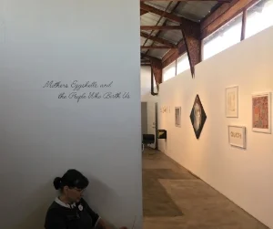 Kim Abeles at the entrance of the exhibition. 