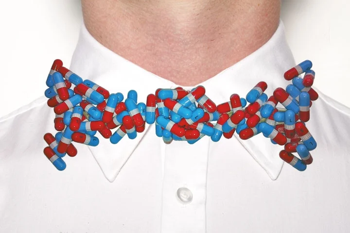  Bow Tie #10. Nicholas Ruiz. Assembled November 2011. Acetaminophen pills, multiple adhesives, plastic knife. Forest Hills, NY. 