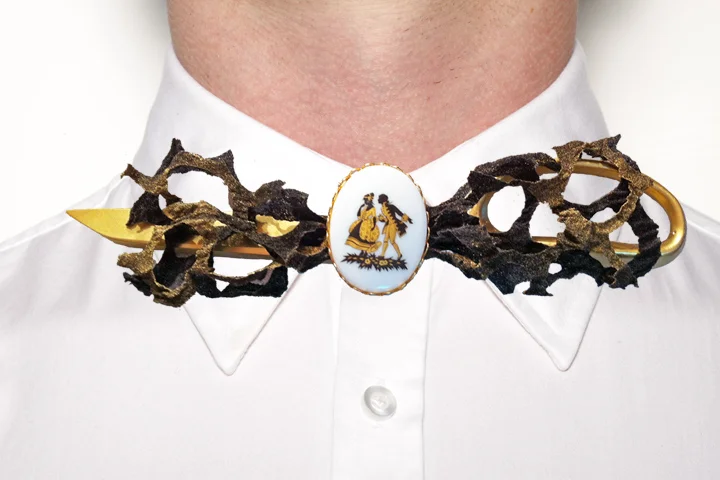 Bow Tie #11. Nicholas Ruiz. Assembled December 2011. Nylon stockings, spray acrylic, spray metallic, metal scissor, twine, metal wiring, women's vintage brooch. Forest Hills, NY.