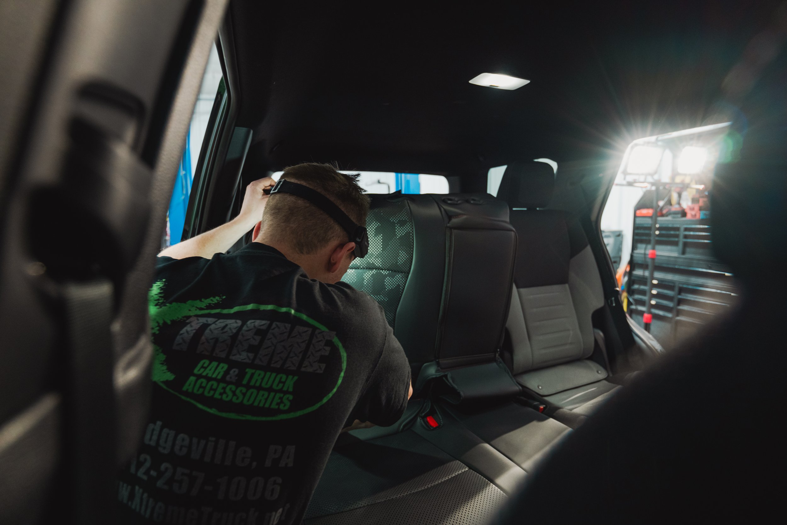 2025 Toyota 4Runner interior with Lexland black nappa leather full coverage camo seat cover installed on the passenger seat — photo by Ian Jones, ISJDesigns