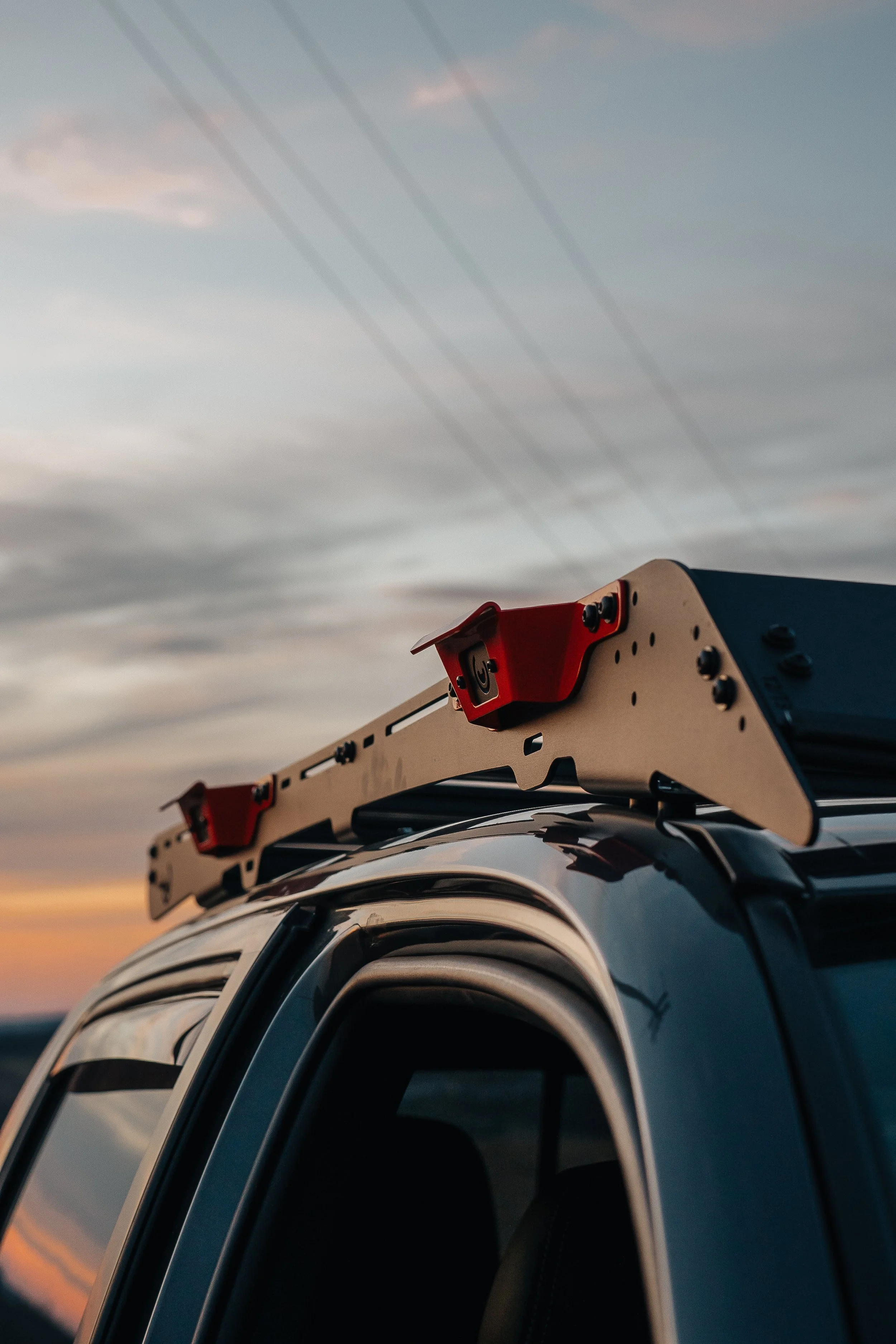 Close-up of Rough Country Vertex adjustable coilover suspension on a lifted 2019 Toyota Tacoma TRD Sport build, photographed by Ian Jones for ISJDESIGNS to show the Tacoma lift kit setup.