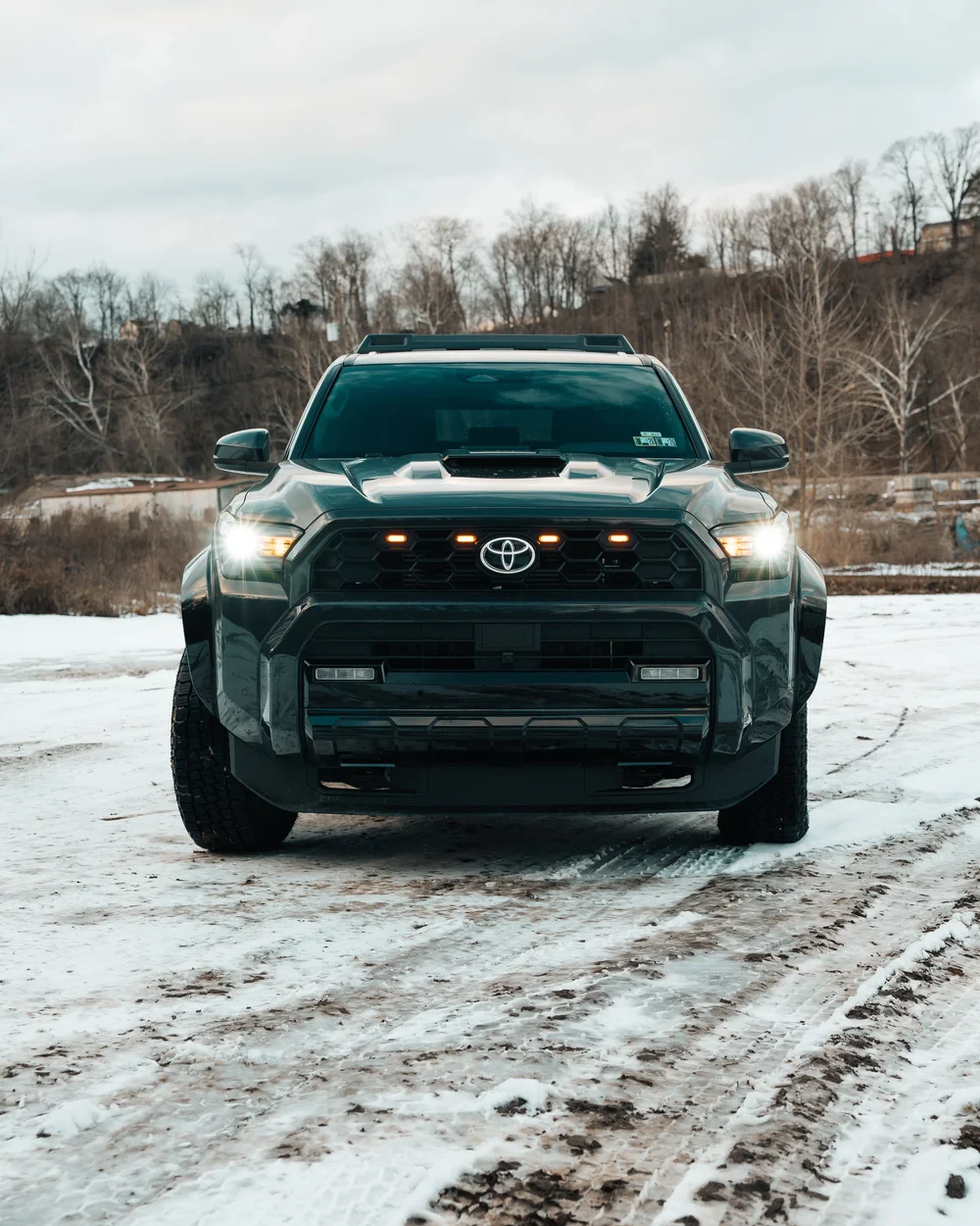 NEOXIST raptor lights installed in the grille of Ian Jones' 2025 Toyota 4Runner TRD Sport, showing 2025 4Runner grille lights, amber lighting detail, and front-end lighting mods for a 6th gen 4Runner build.