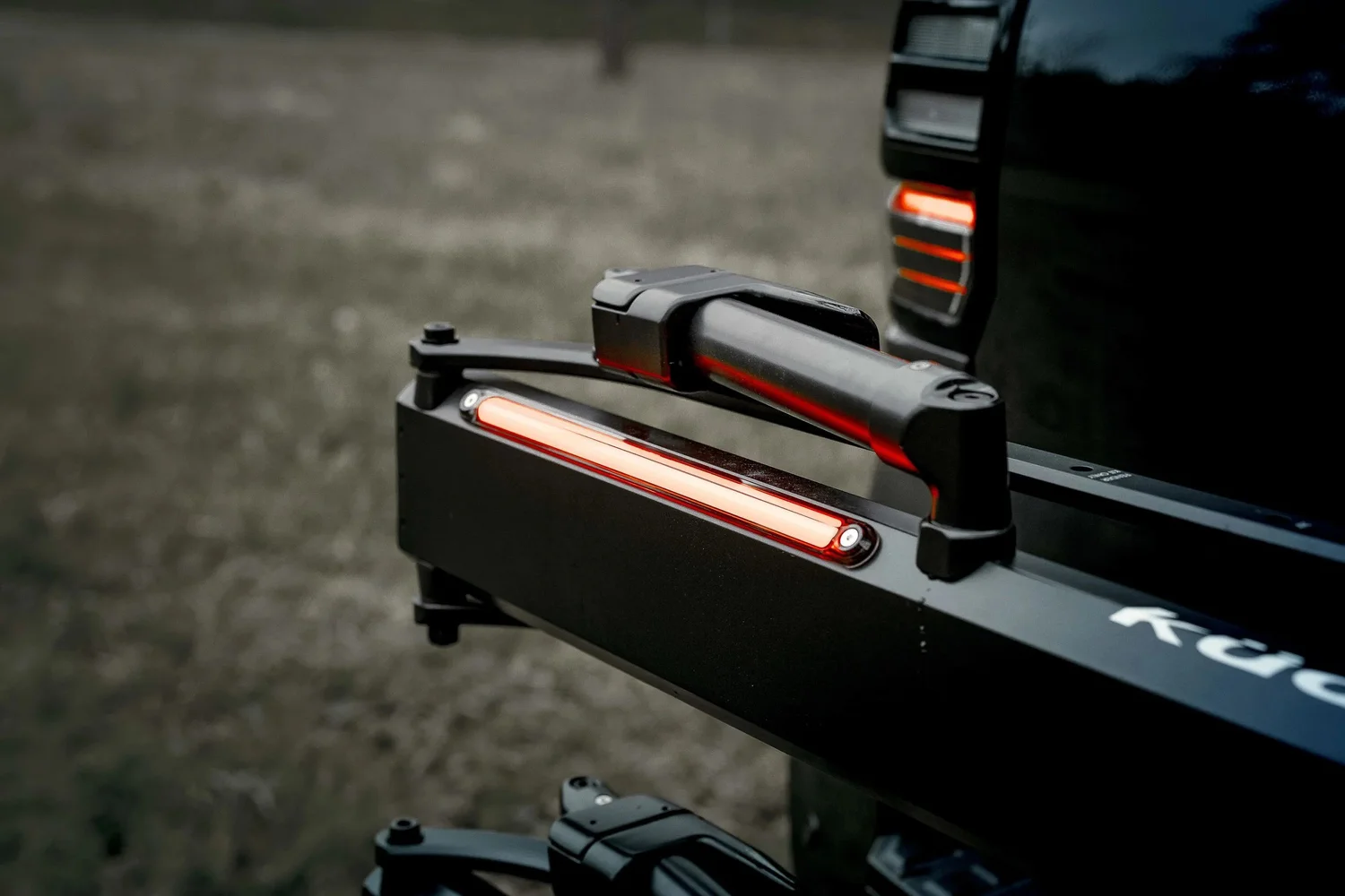 Kuat Piston Pro X rack arm and integrated light, black hardware lit to stay separate. Ian Jones, ISJDESIGNS.