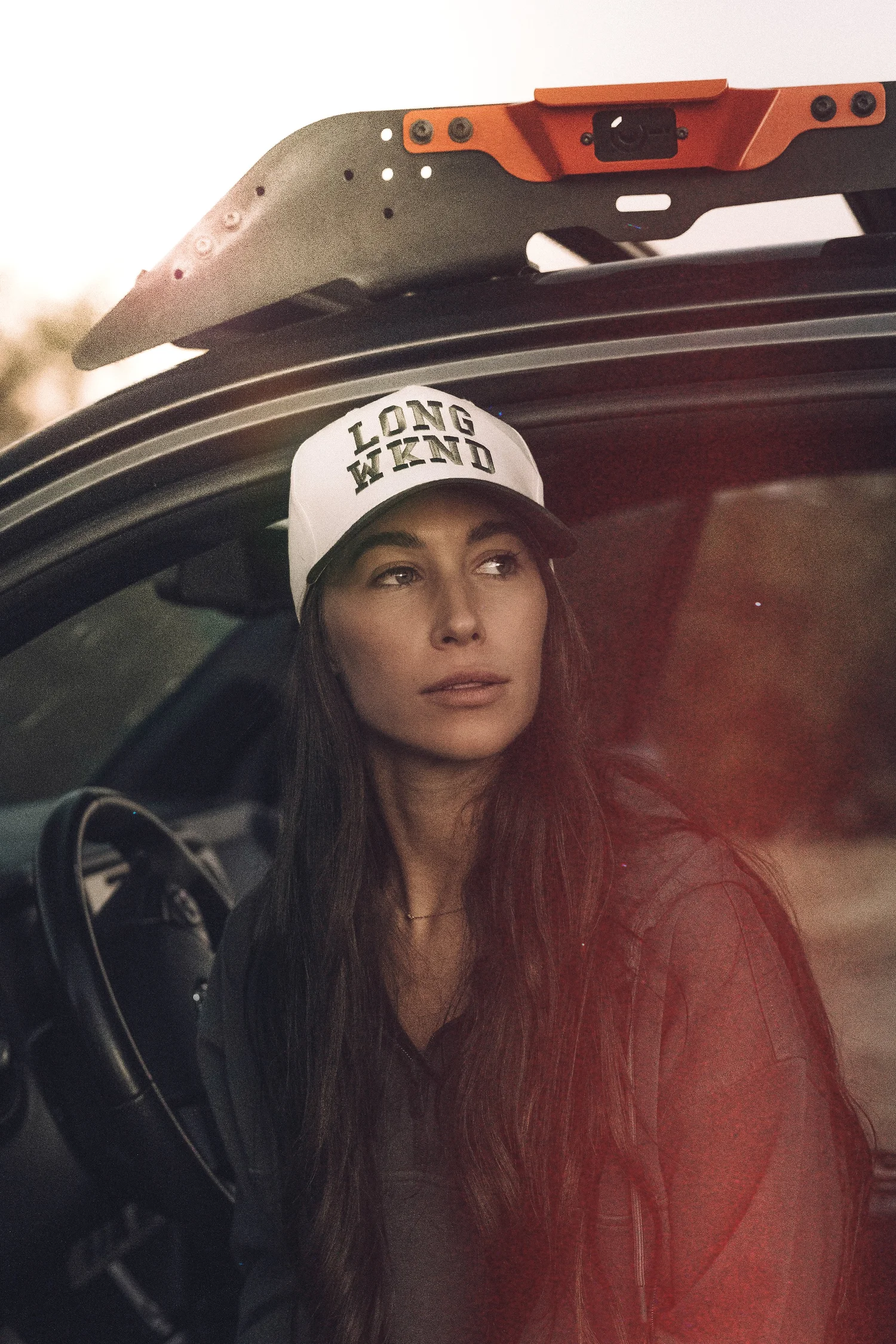 Lifestyle portrait in a Toyota Tacoma doorway, model in a white cap, shot by Pittsburgh photographer Ian Jones of ISJDESIGNS.