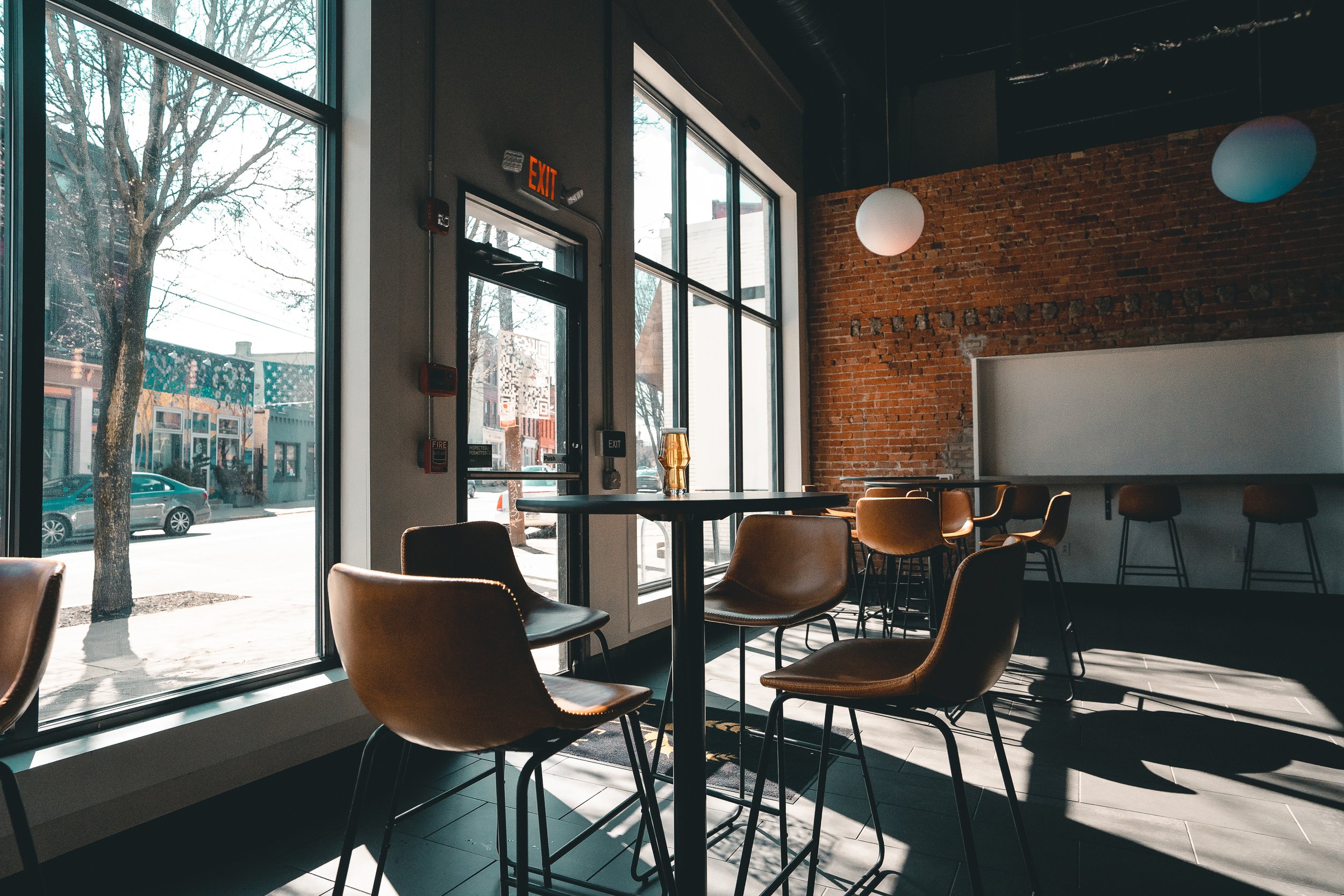 Cinematic Pittsburgh restaurant interior photography by Ian Jones highlighting dining atmosphere, seating, and natural light