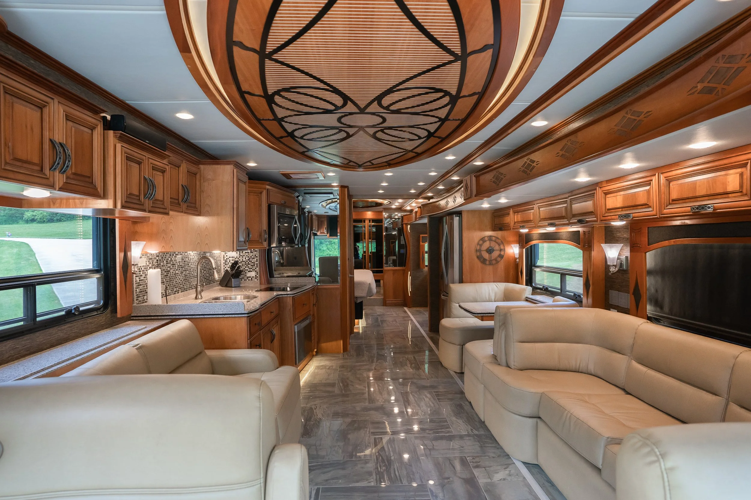 Cinematic interior photography of luxury RV with leather seating and custom wood design by Pittsburgh commercial photographer Ian Jones