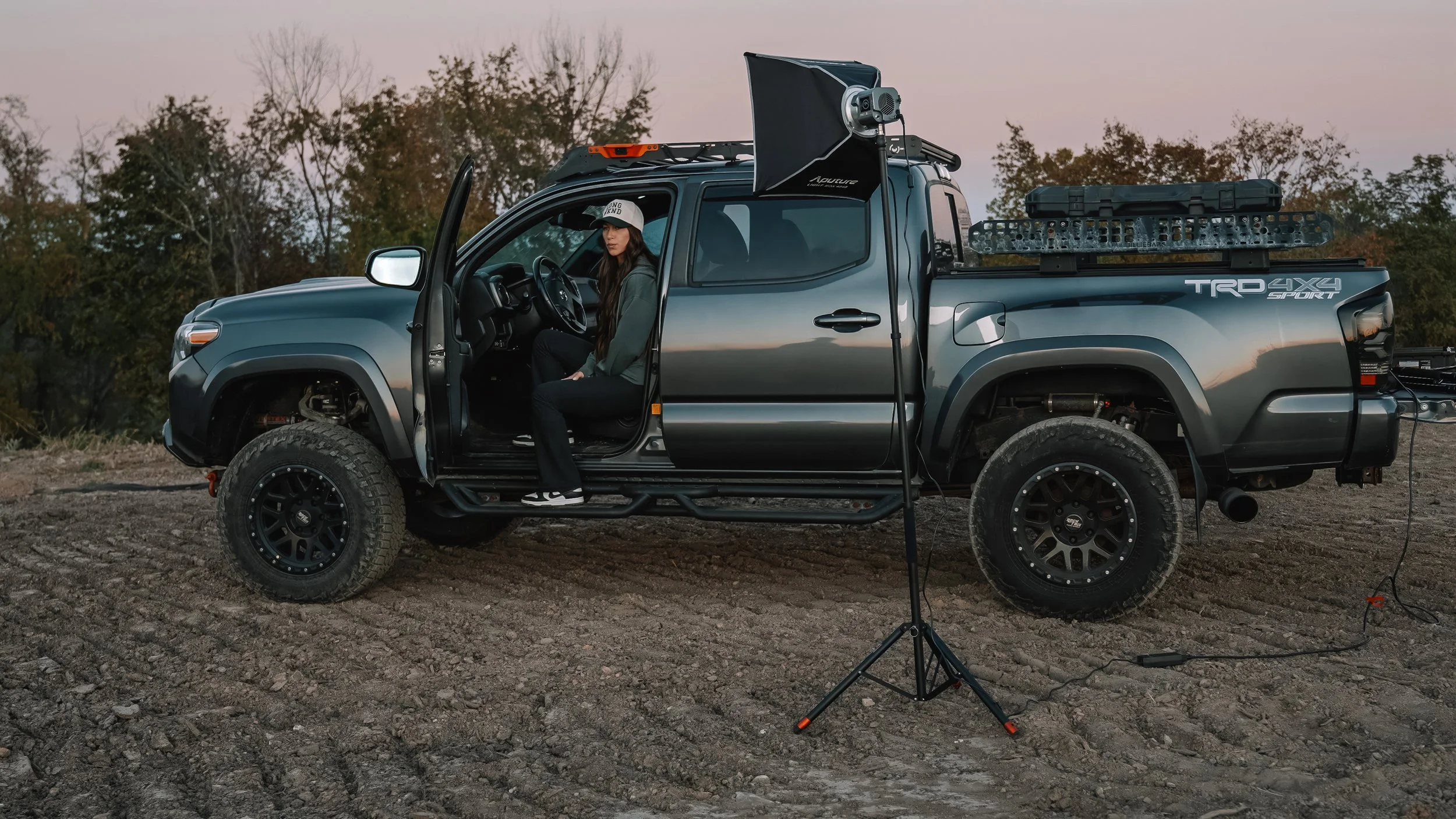 Ian Jones using his Toyota Tacoma mobile studio and ProMaster light stand to shoot UGC content on location near Pittsburgh.
