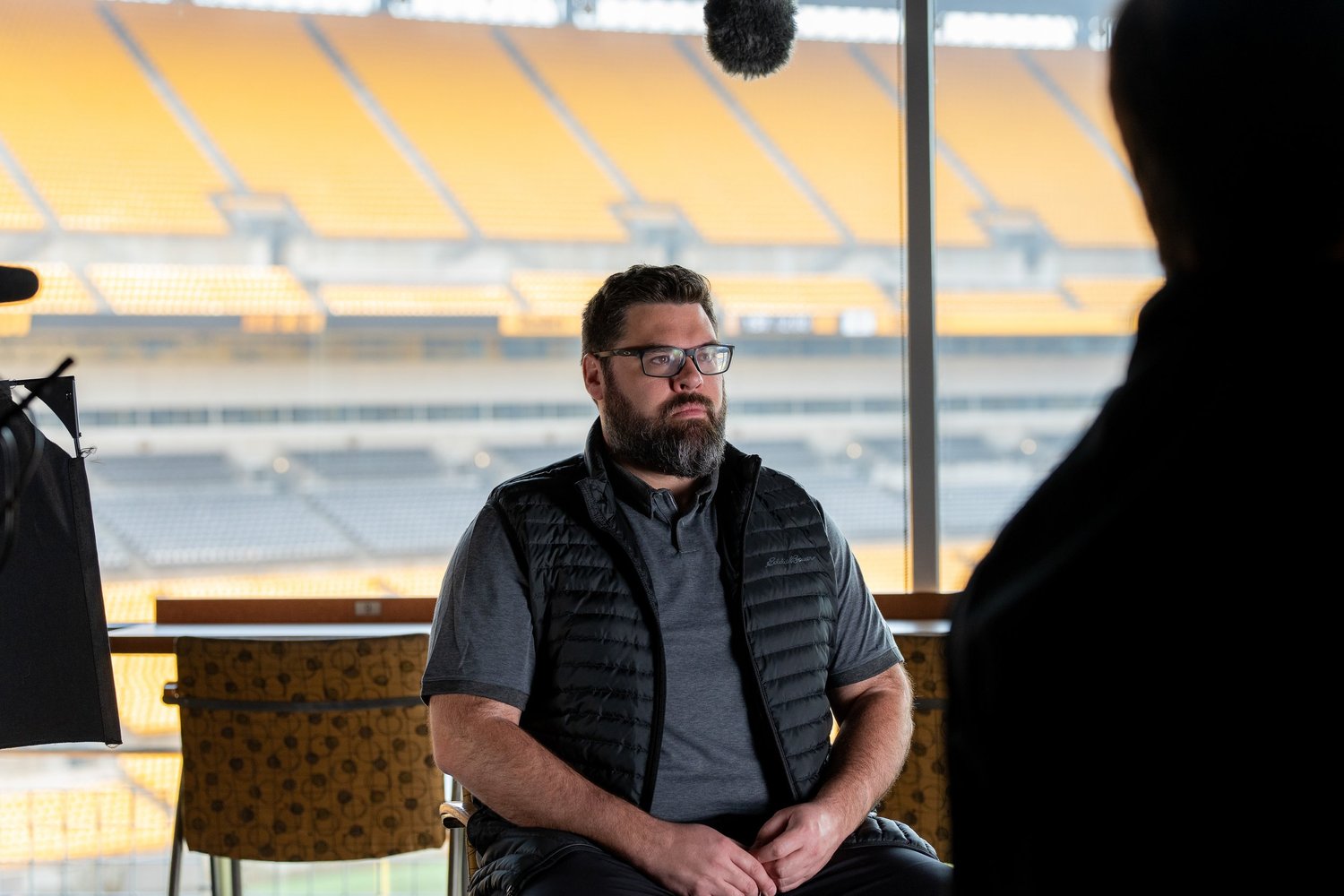 Pittsburgh corporate and commercial photographer documenting a professional interview production in an Acrisure Stadium suite setting
