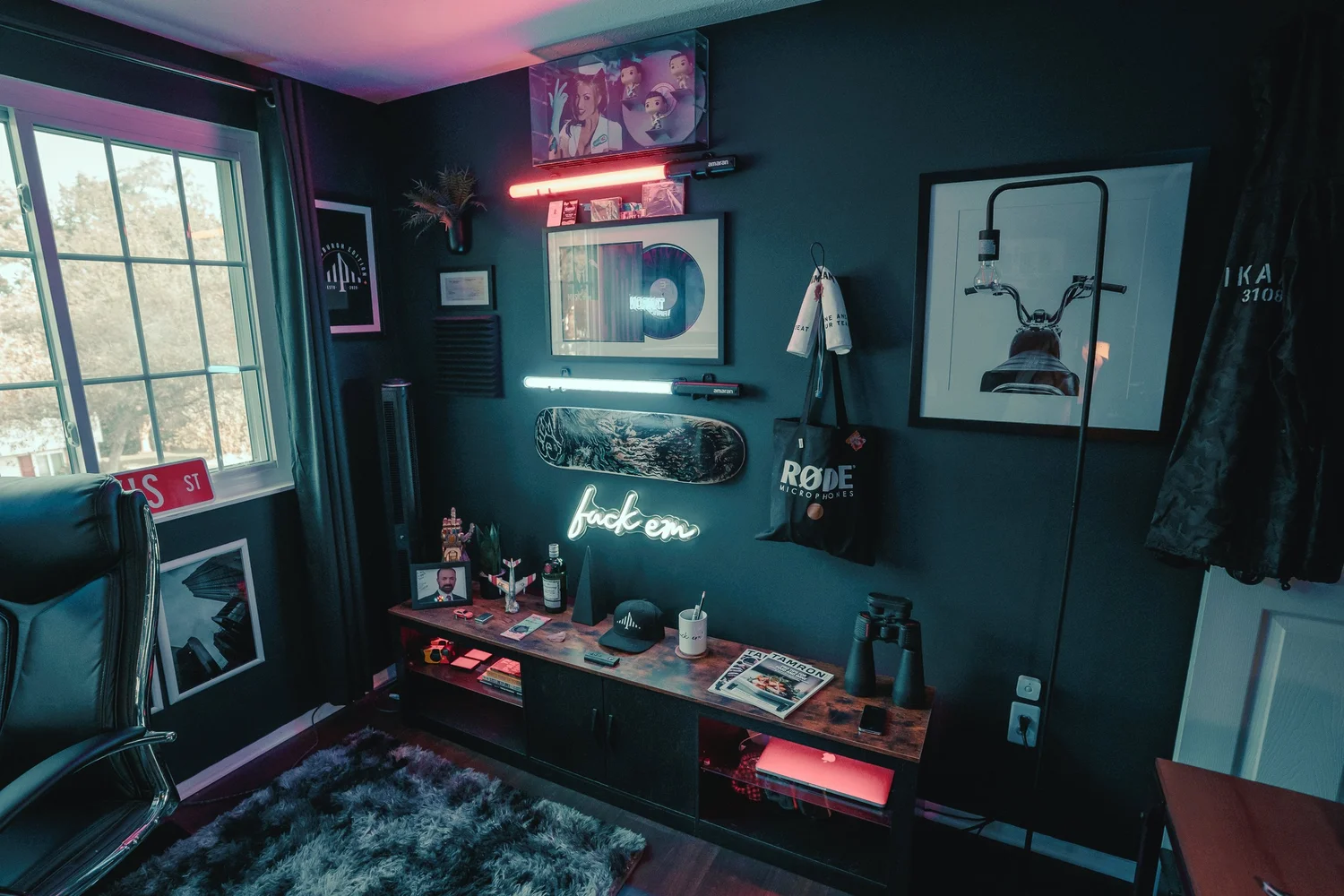 Ian Jones Pittsburgh home office and studio wall with Aputure tube lights, framed art, plants, and creator gear