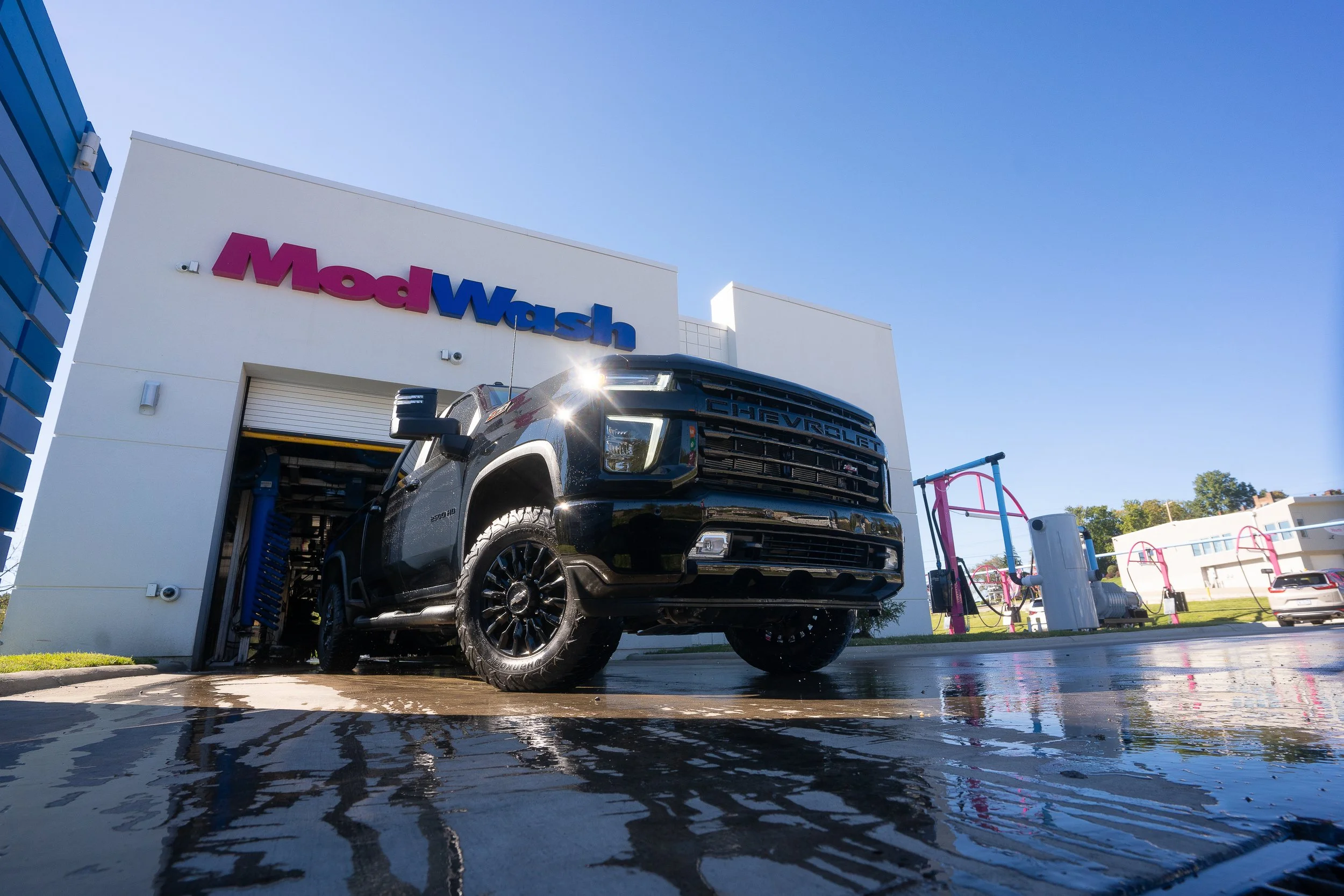 Pittsburgh automotive photography of black Chevrolet truck exiting ModWash car wash captured by Ian Jones