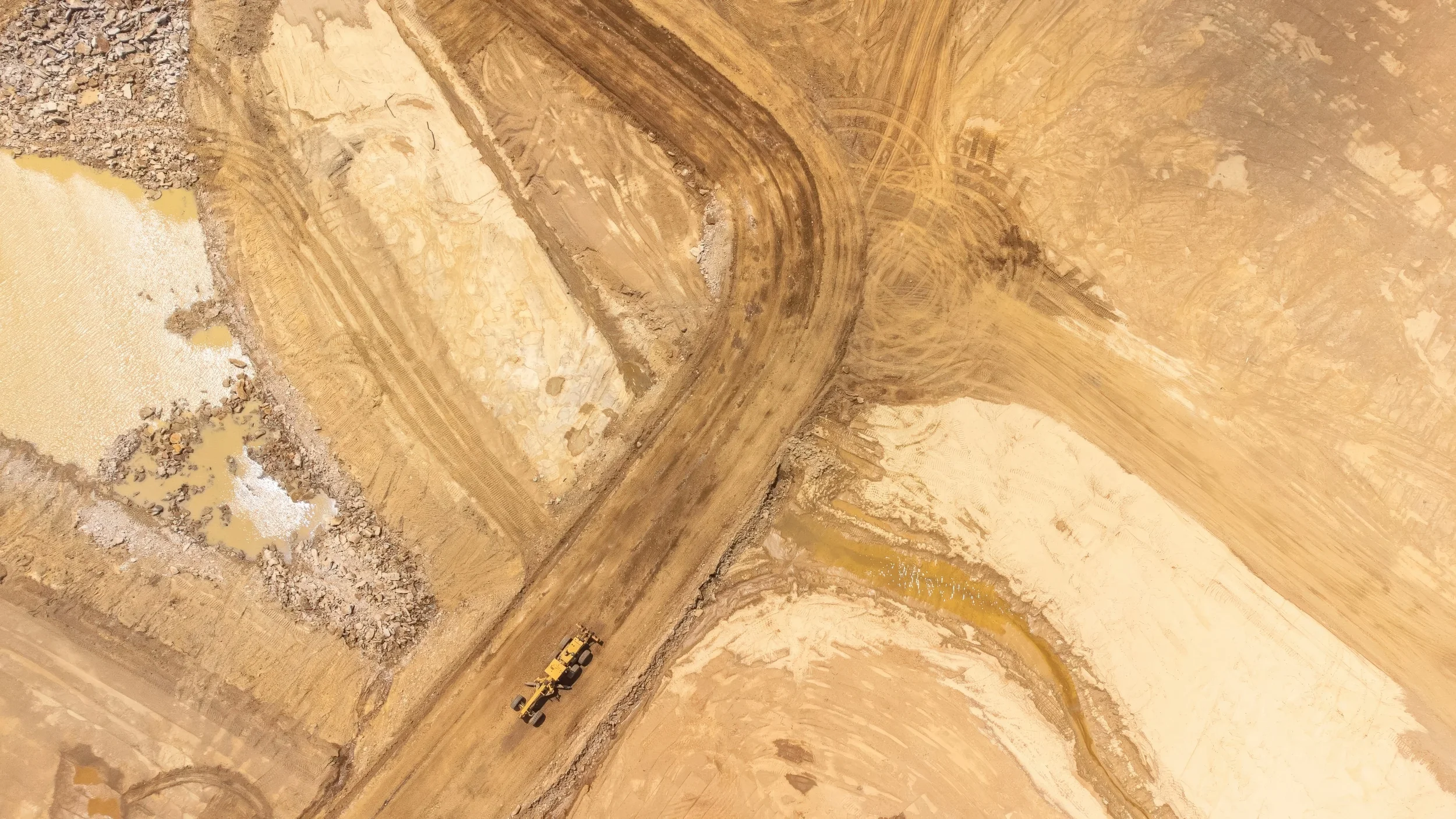 Pittsburgh construction progress drone photography by Ian Jones showing an active excavation site from above for contractors and developers in Western PA.