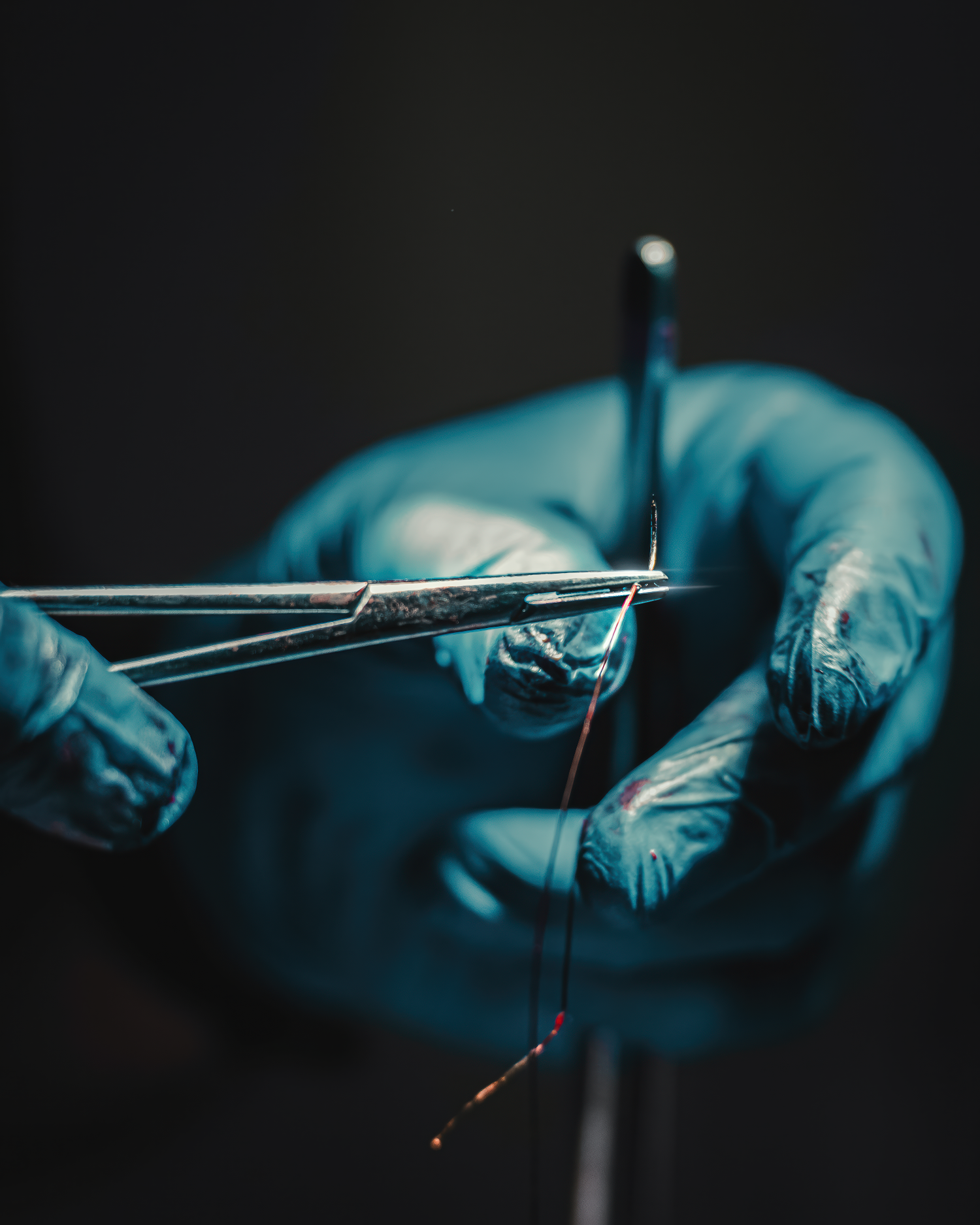 Surgical instruments and suture detail captured by Pittsburgh healthcare photographer Ian Jones
