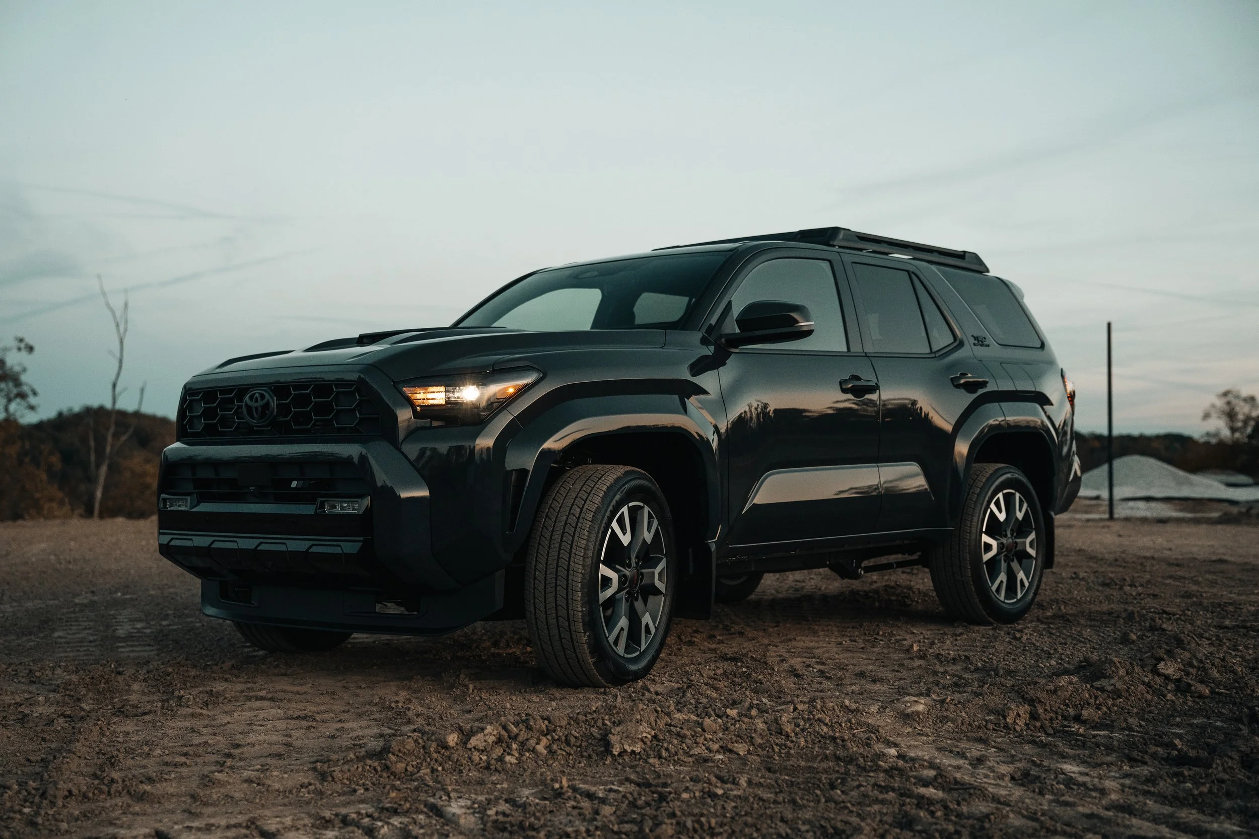 Front three-quarter view of Ian Jones' 2025 Toyota 4Runner TRD Sport in Underground gray, showing 6th gen front-end styling and OEM grille detail.