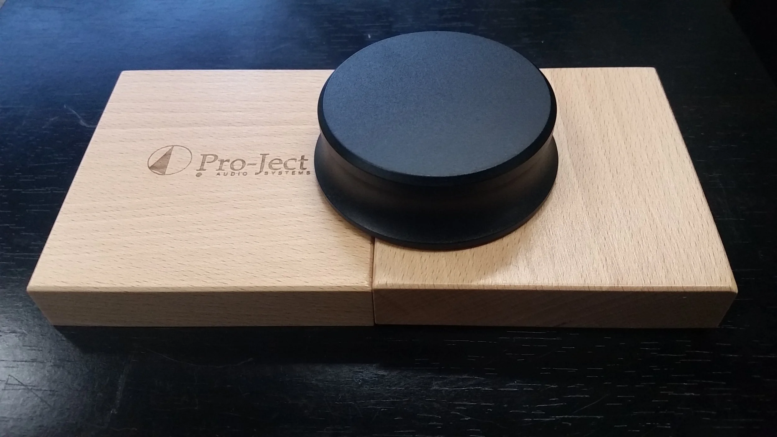 HIGH QUALITY PRO-JECT BRAND HEAVY (750 GRAM) RECORD PUCK ENSURES RECORDS SIT FLAT ON TURNTABLE PLATTER...COMES IN WOODEN PRESENTATION BOX ONLY $99 EACH