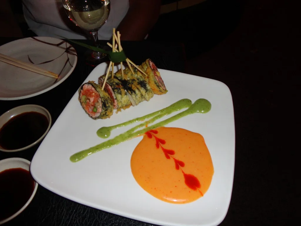 Sushiya Signature Roll: Salmon, spicy tuna, crab, avocado, asparagus, ginger, with a hint of mashed potatoes (yes, potatoes!) wrapped in seaweed, tempura fried, with spicy cilantro cream sauce.